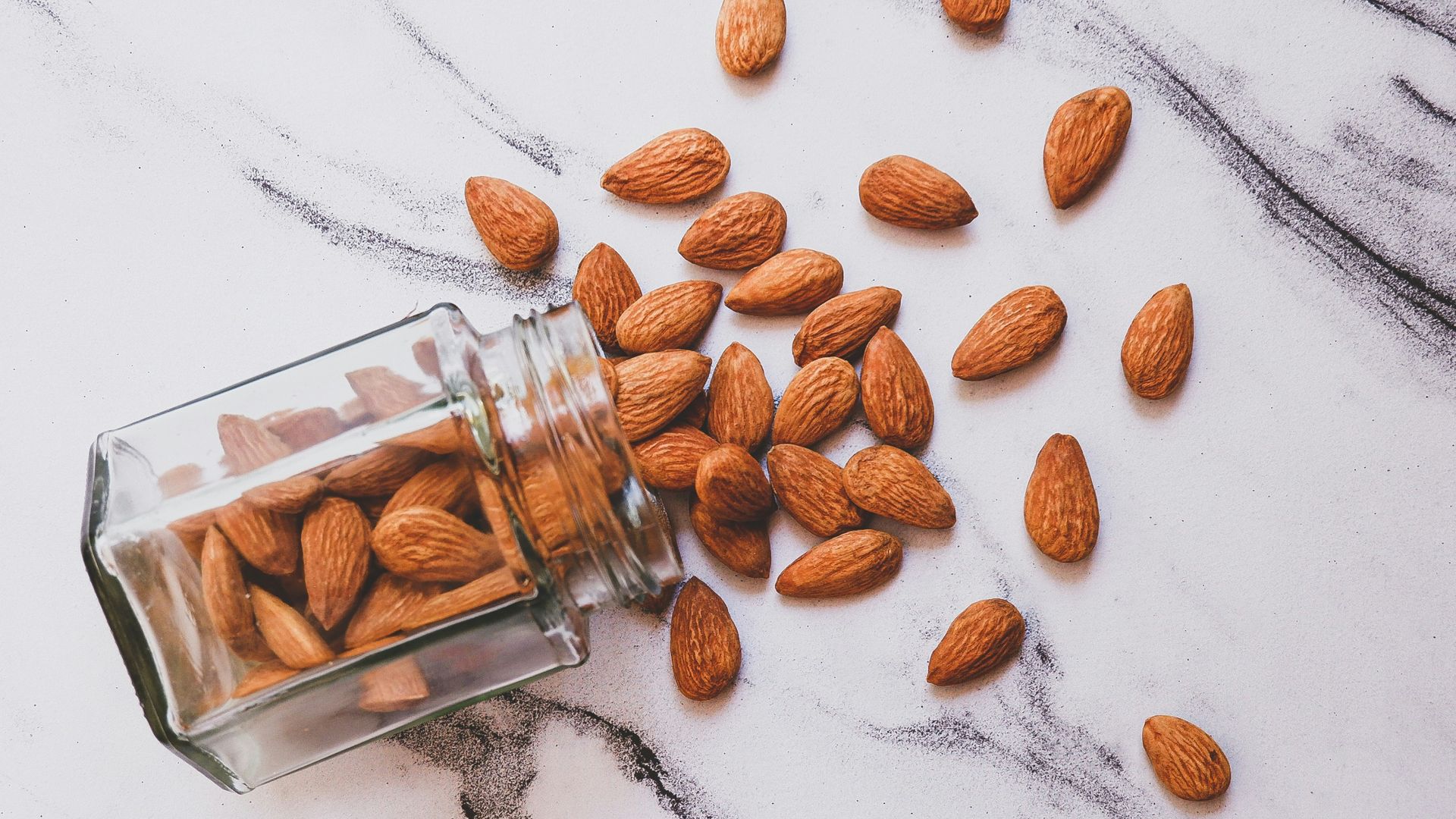 brown almond on white table