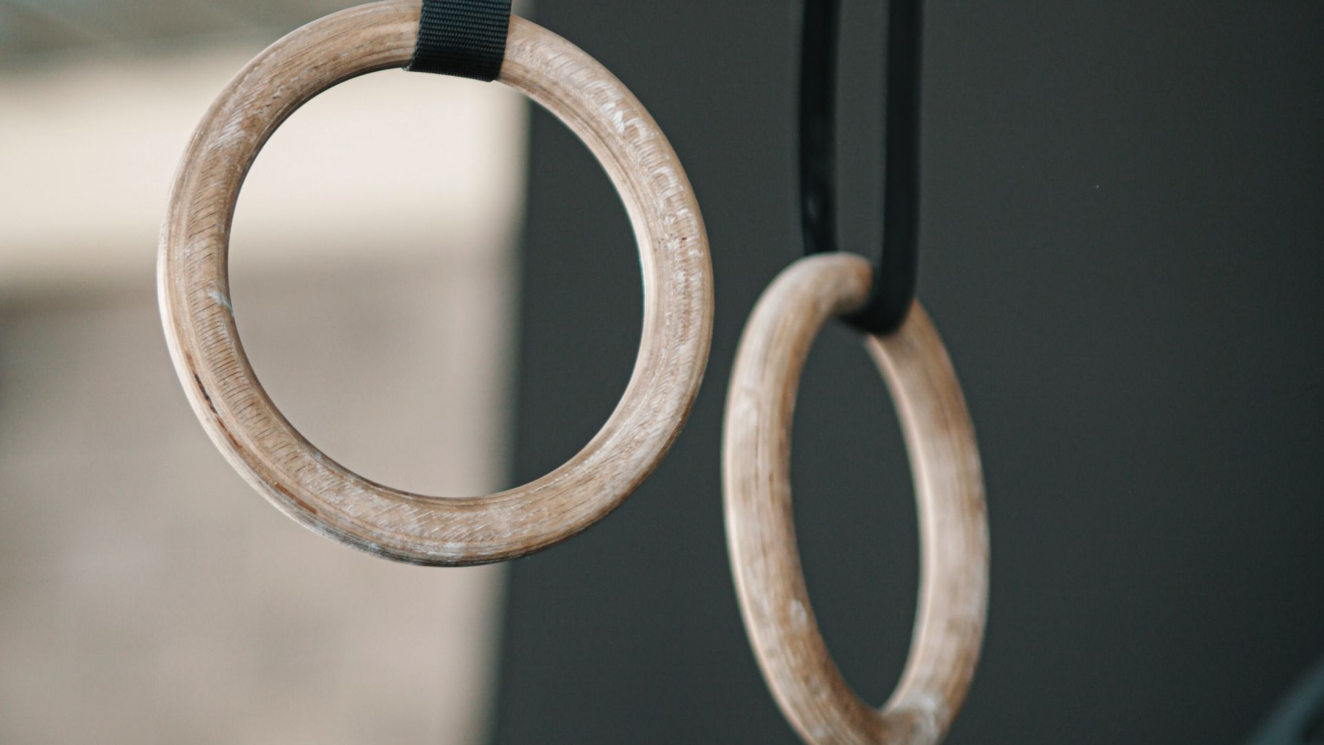 gold ring on black metal fence