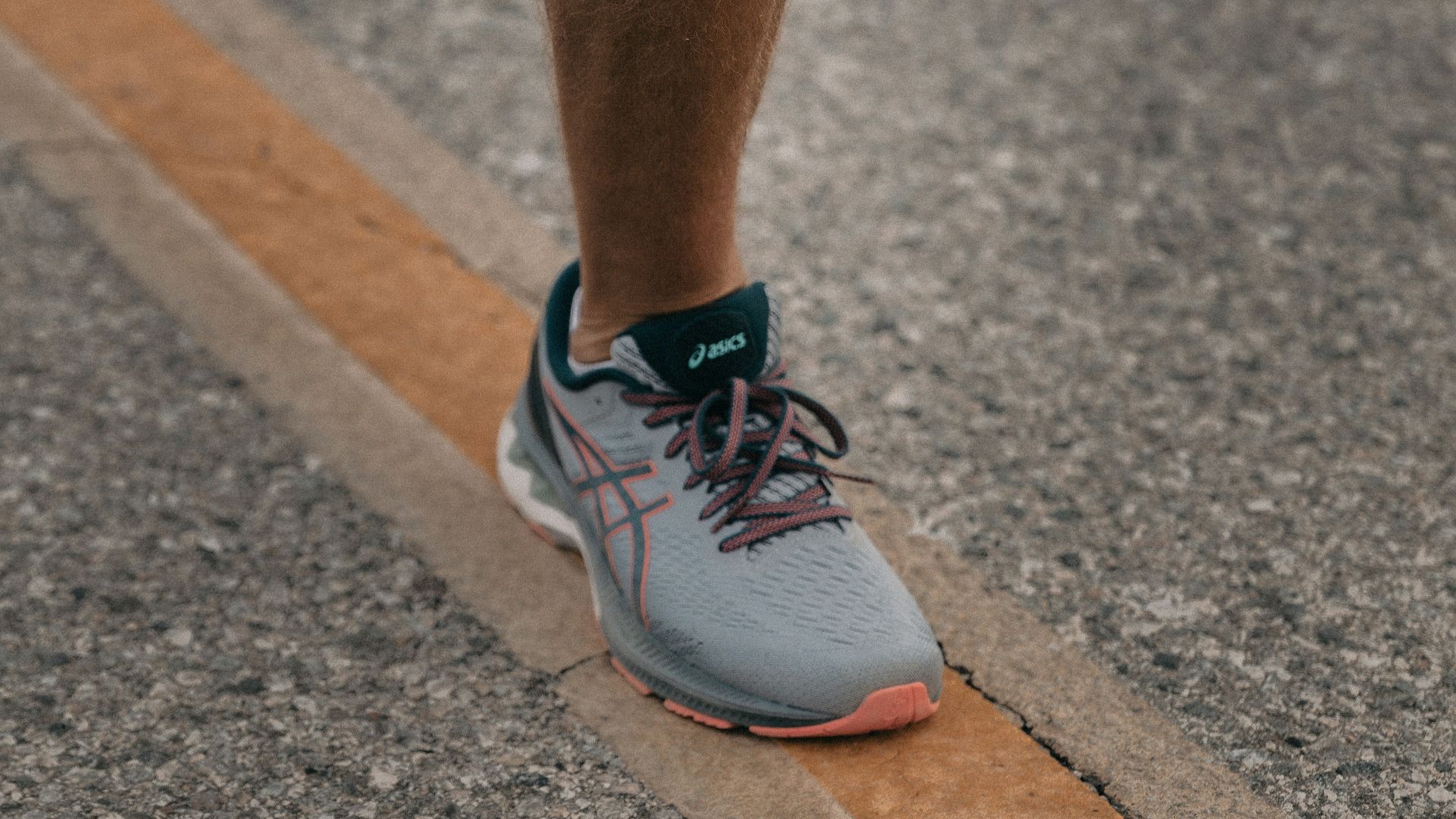 person in white nike sneakers