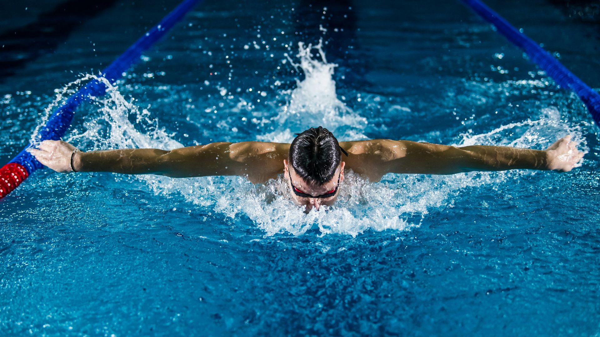 man doing butterfly stroke