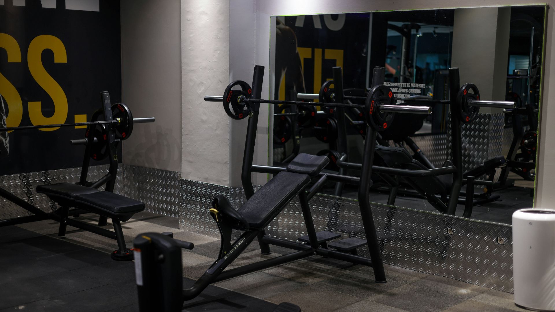 a gym with a mirror and exercise equipment