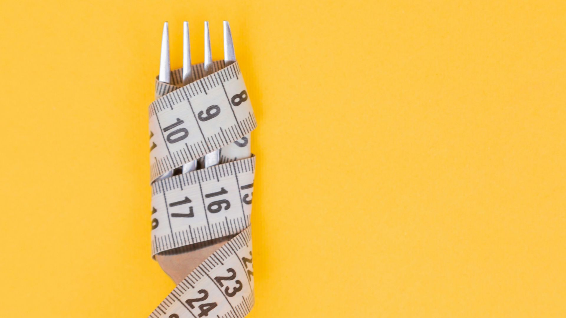 white and black pencil on yellow surface