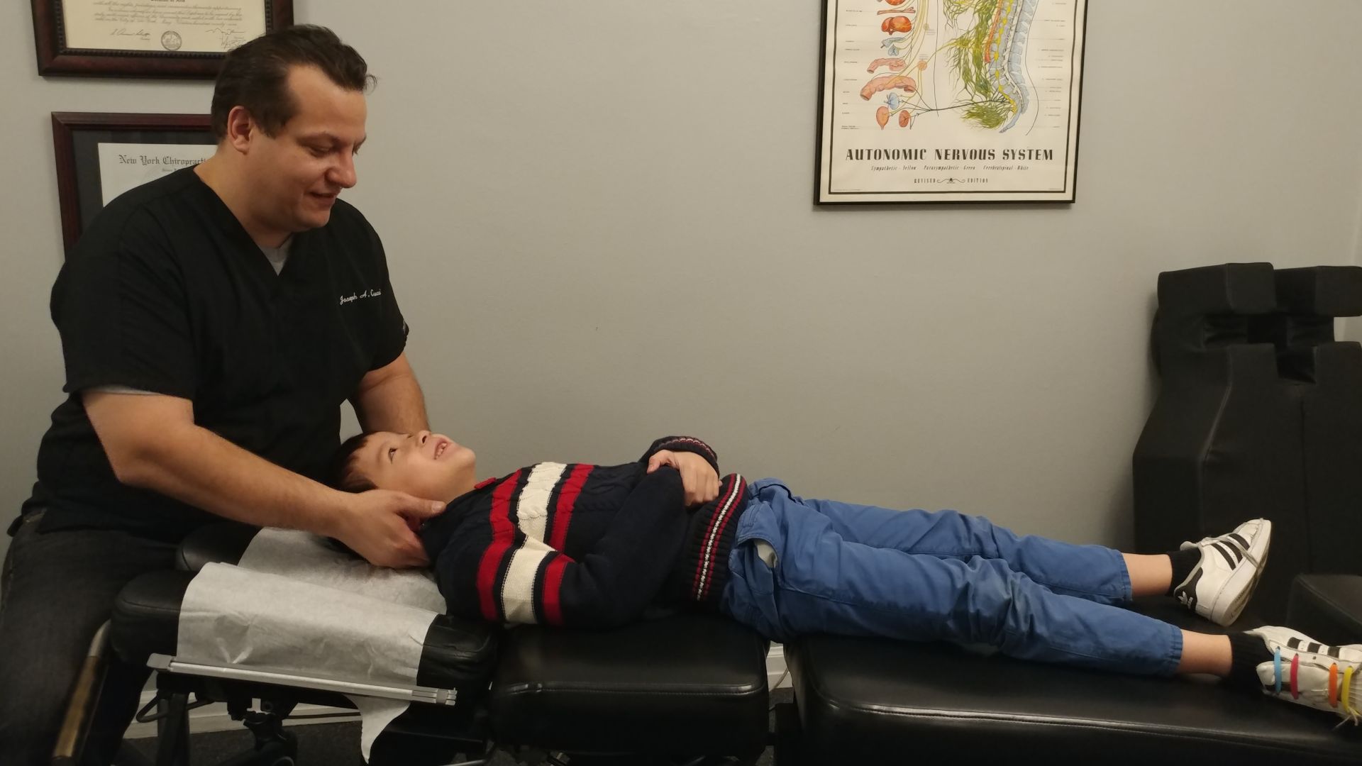 File:Chiropractic adjustment on child.jpg