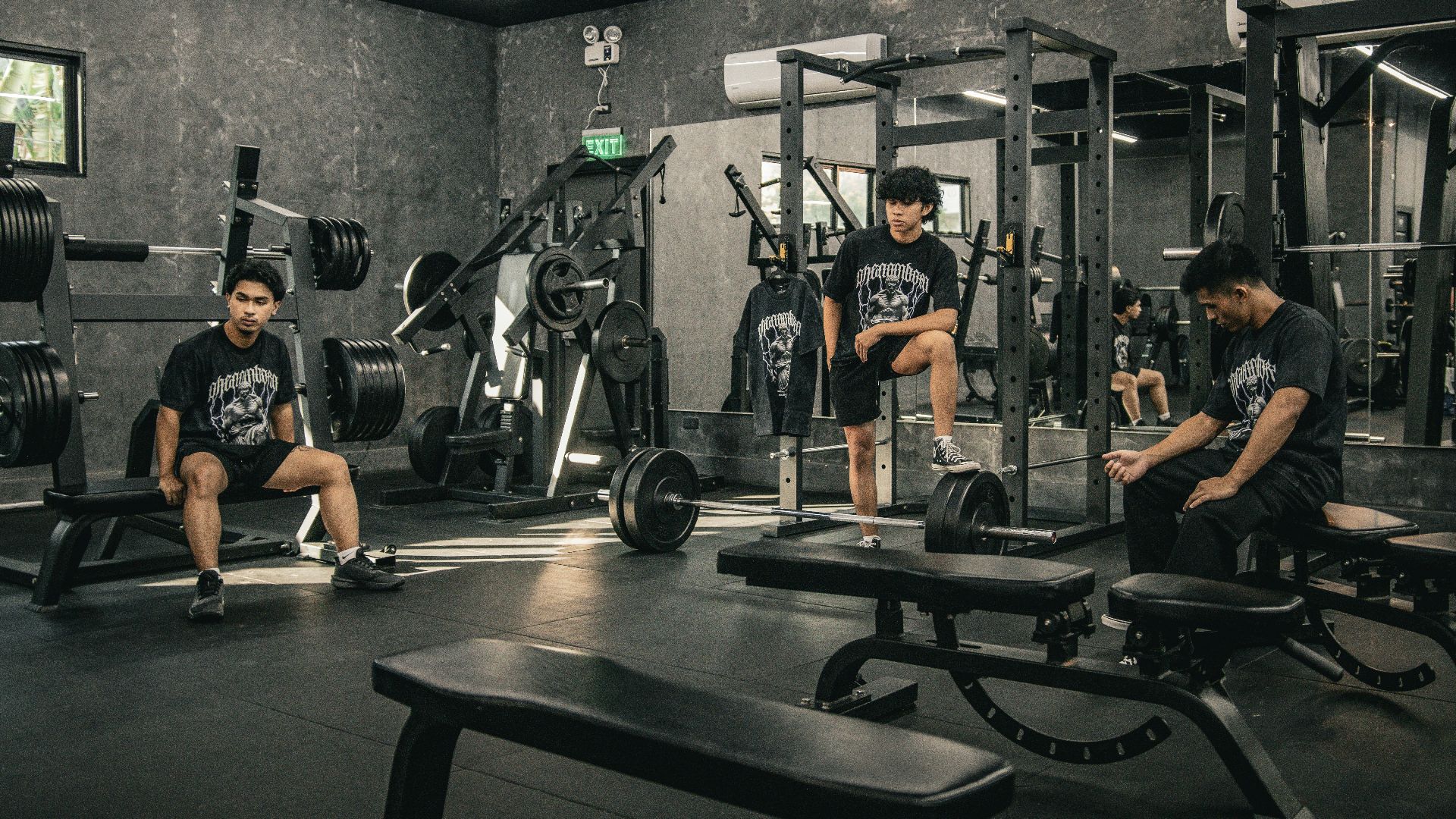 A group of men sitting in a gym