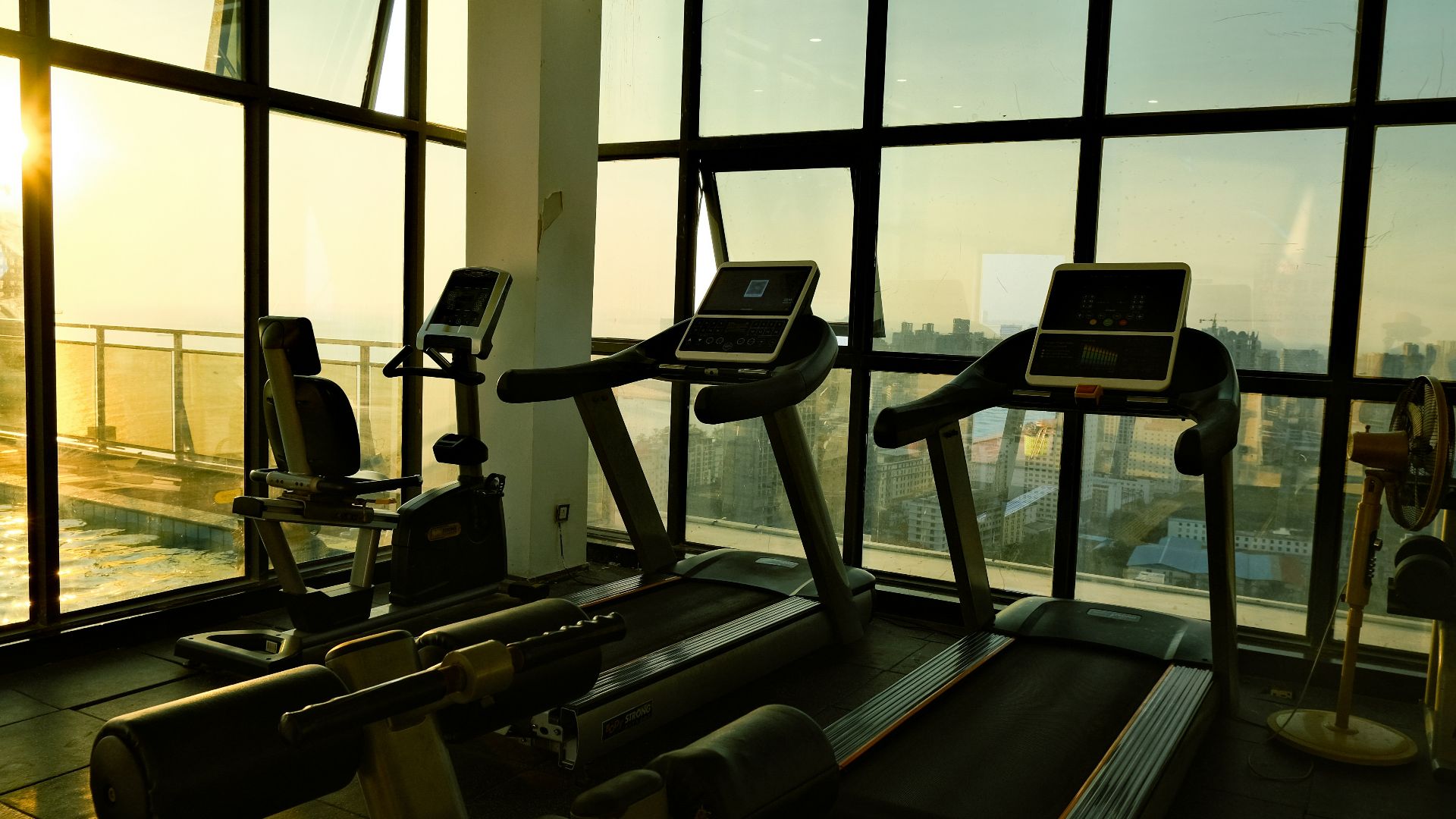 a gym with a view of the city