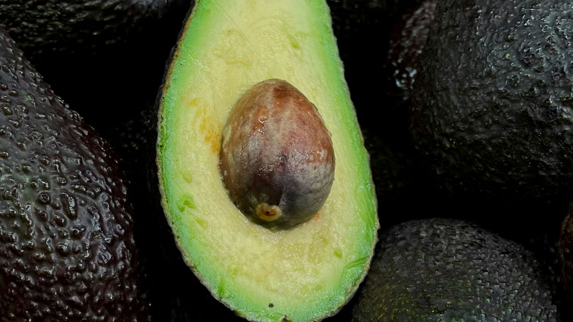 green and brown fruit on black and brown fruits