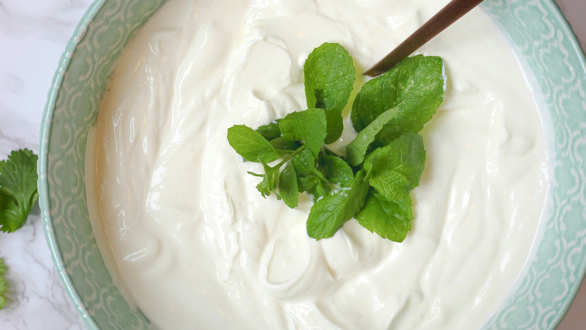 a bowl of yogurt with a spoon in it