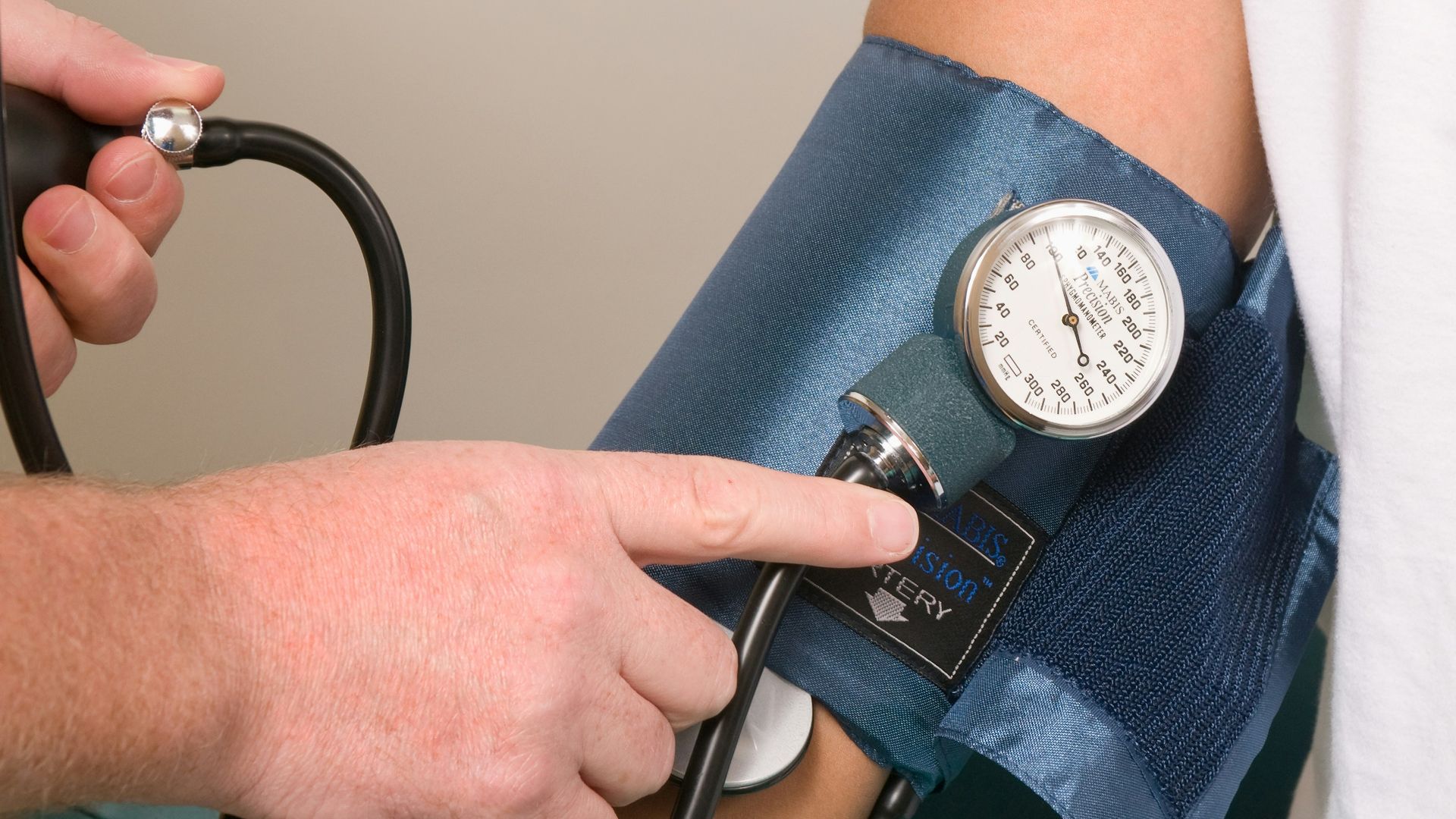 a doctor checking the blood pressure of a patient