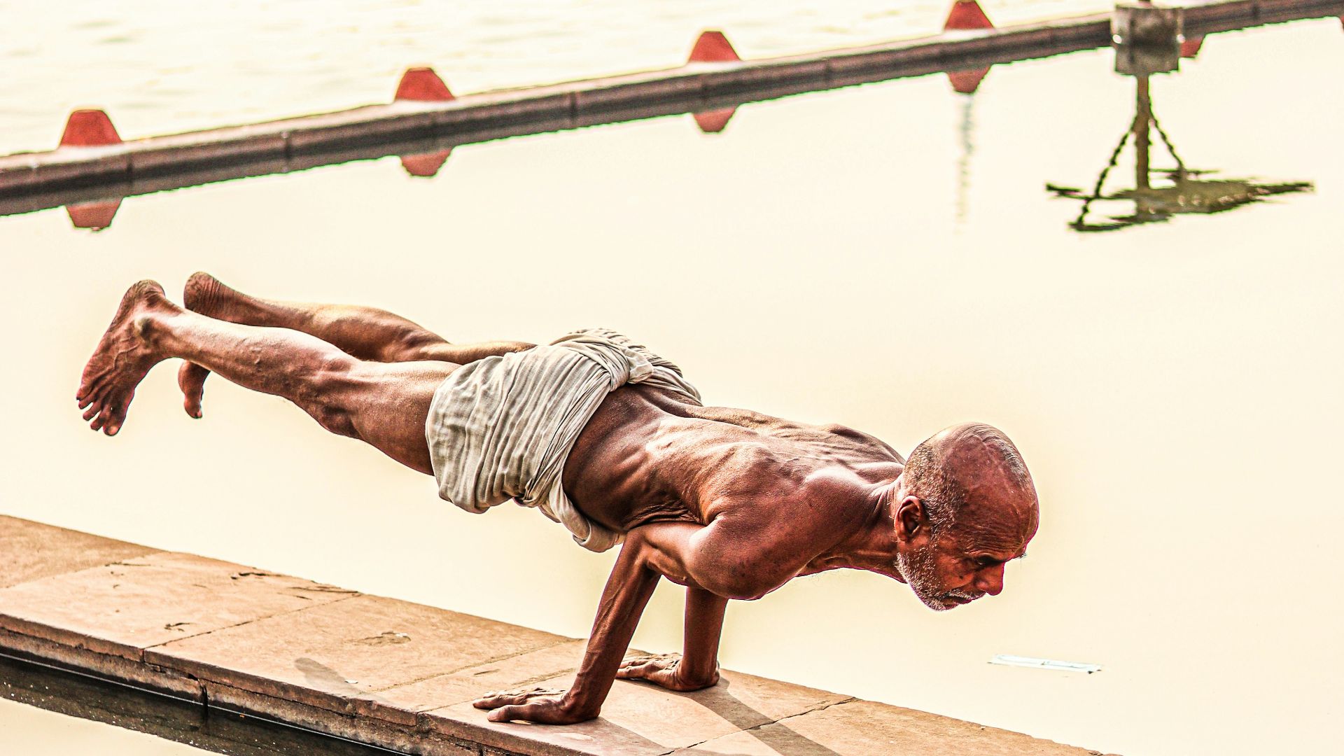 a person standing next to a body of water