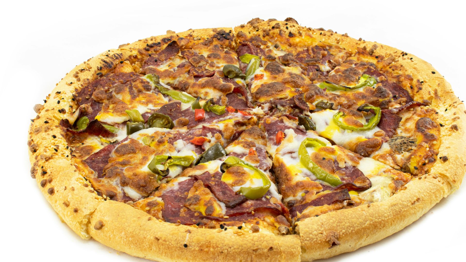 a pizza with various toppings on a white background