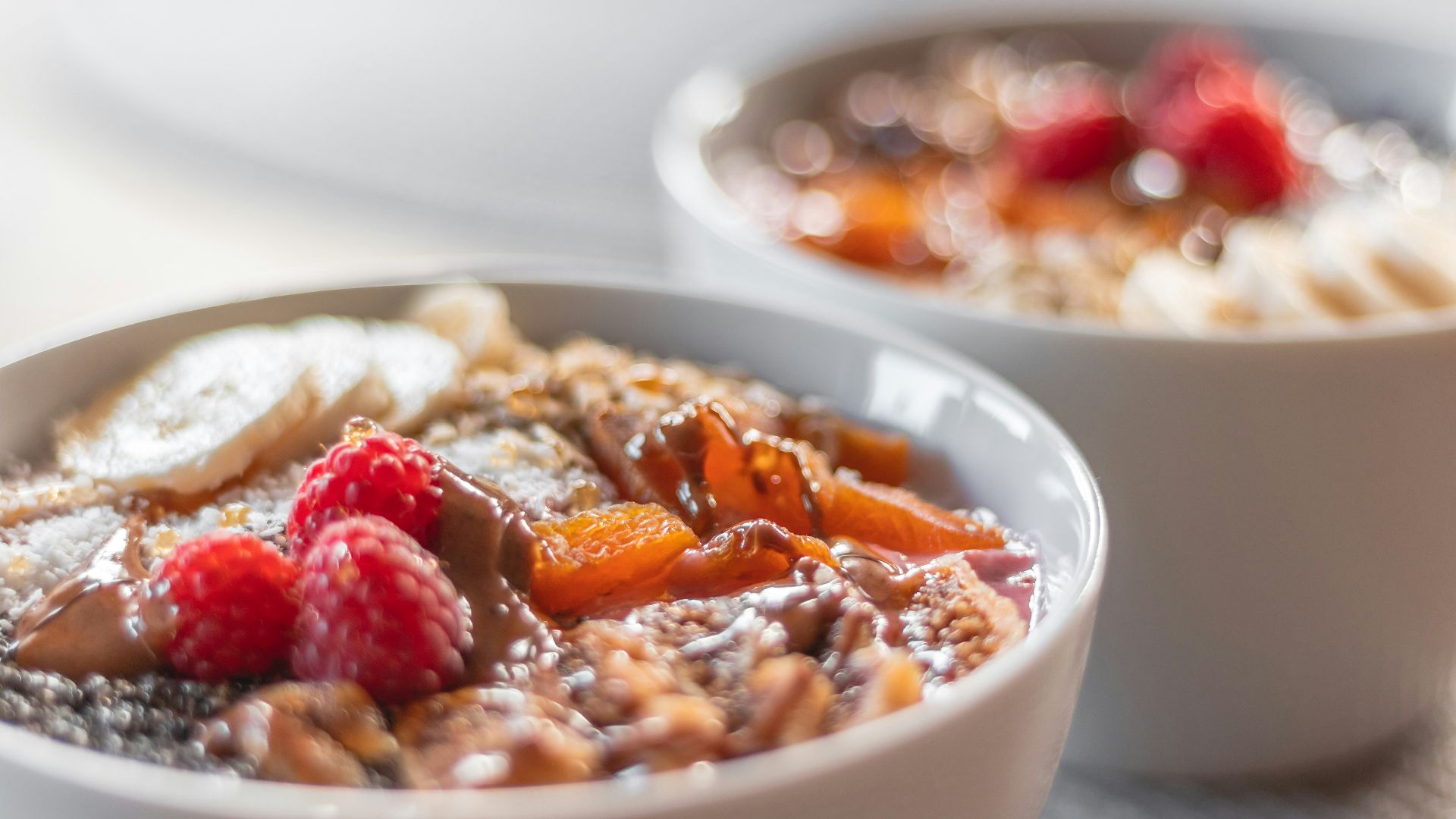 a bowl of oatmeal with fruit on top