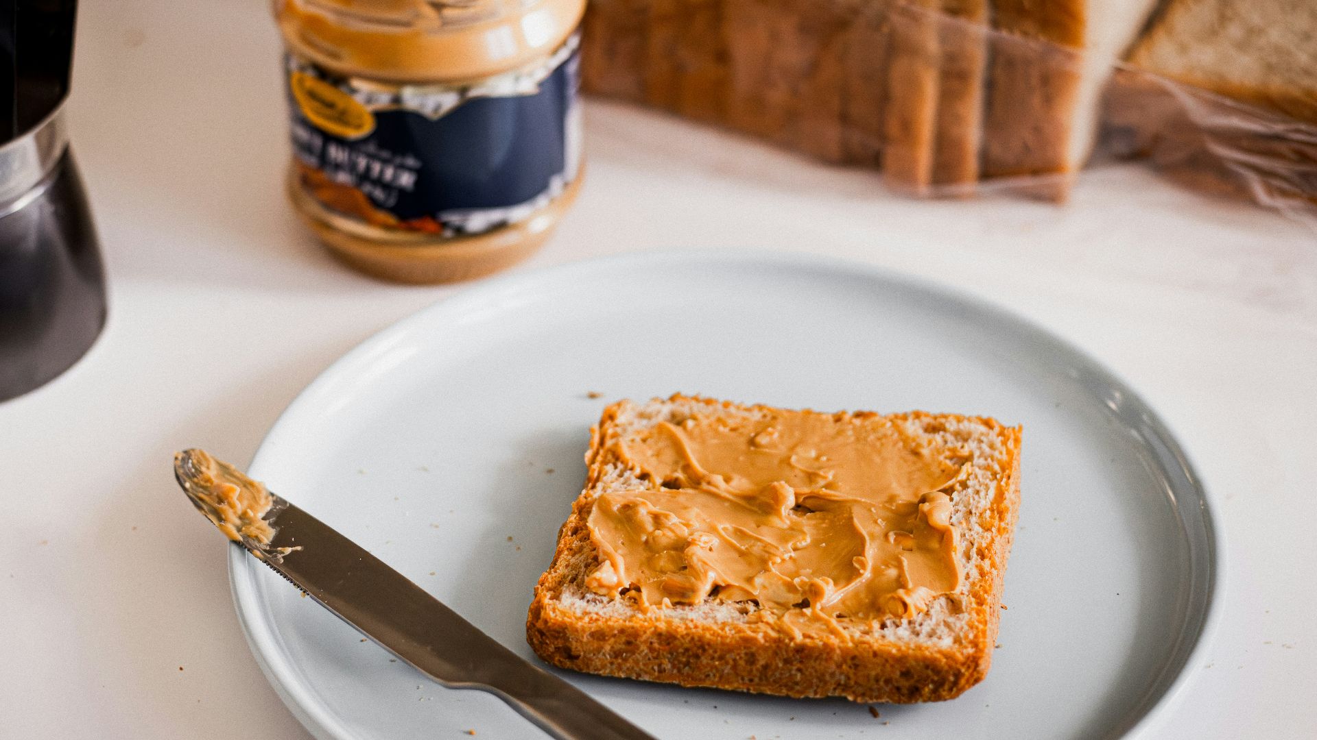 a piece of bread sitting on top of a white plate