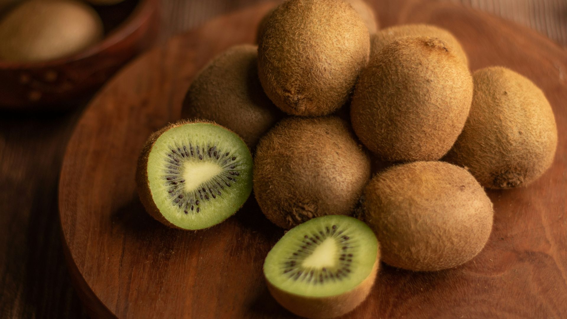 brown round fruit on brown wooden table