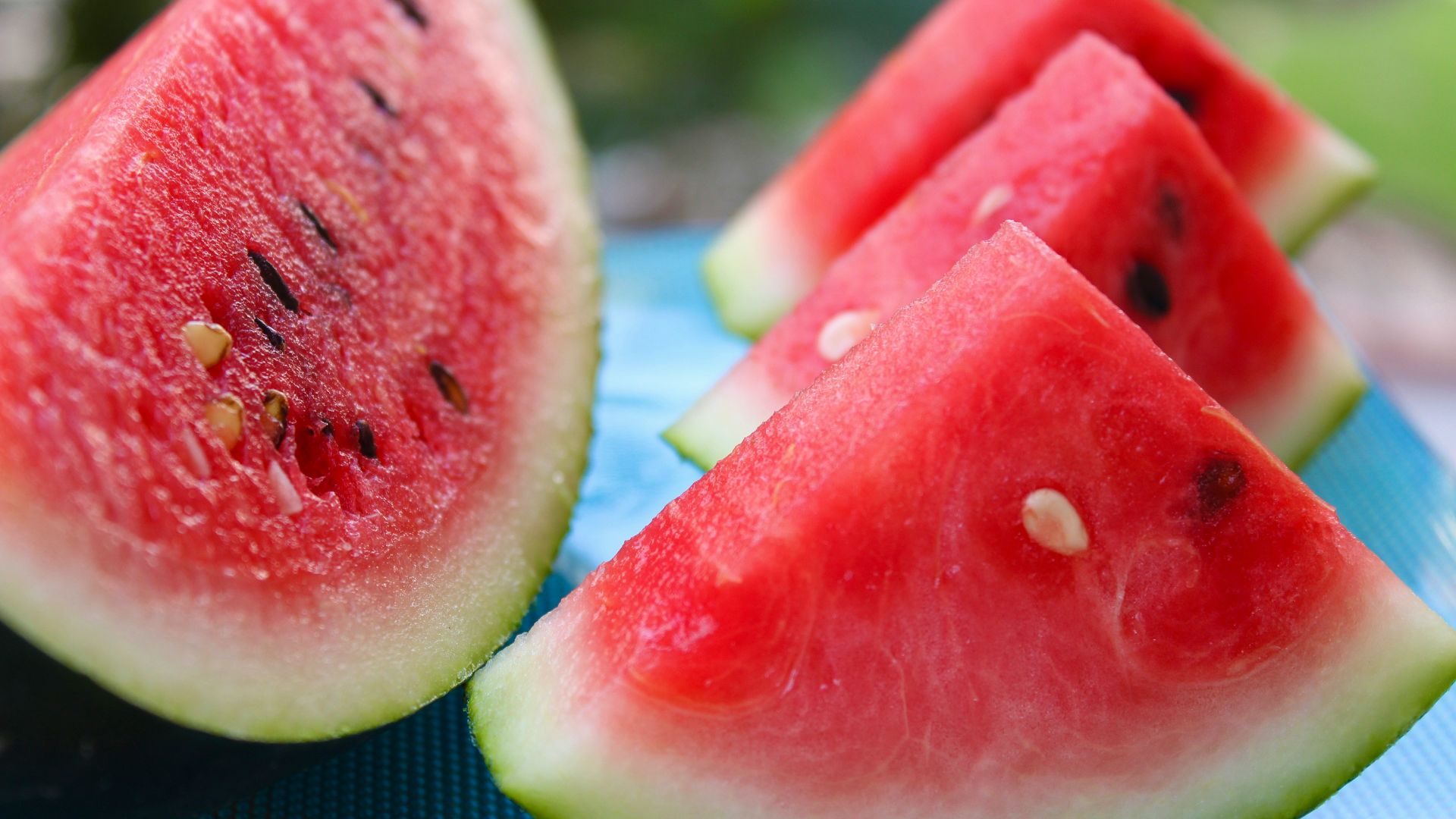 sliced watermelon on white table