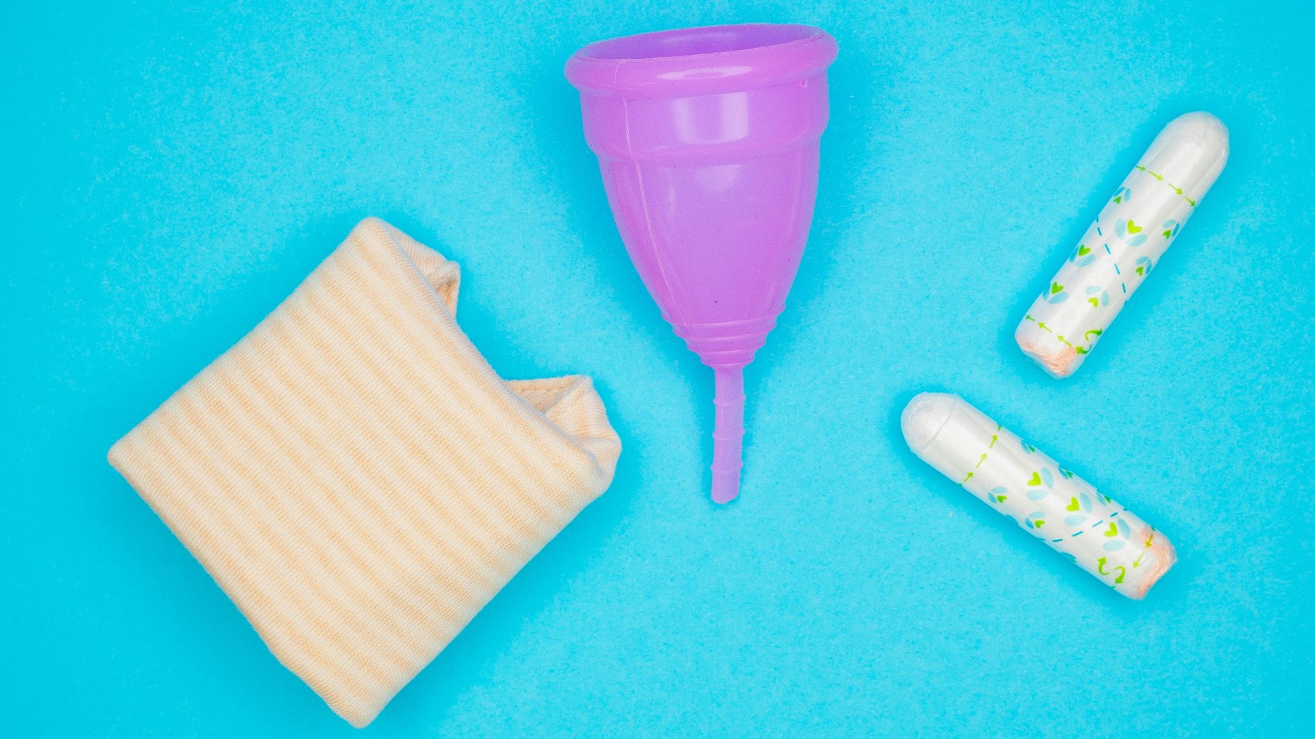 a purple plastic cup next to a small purple cup