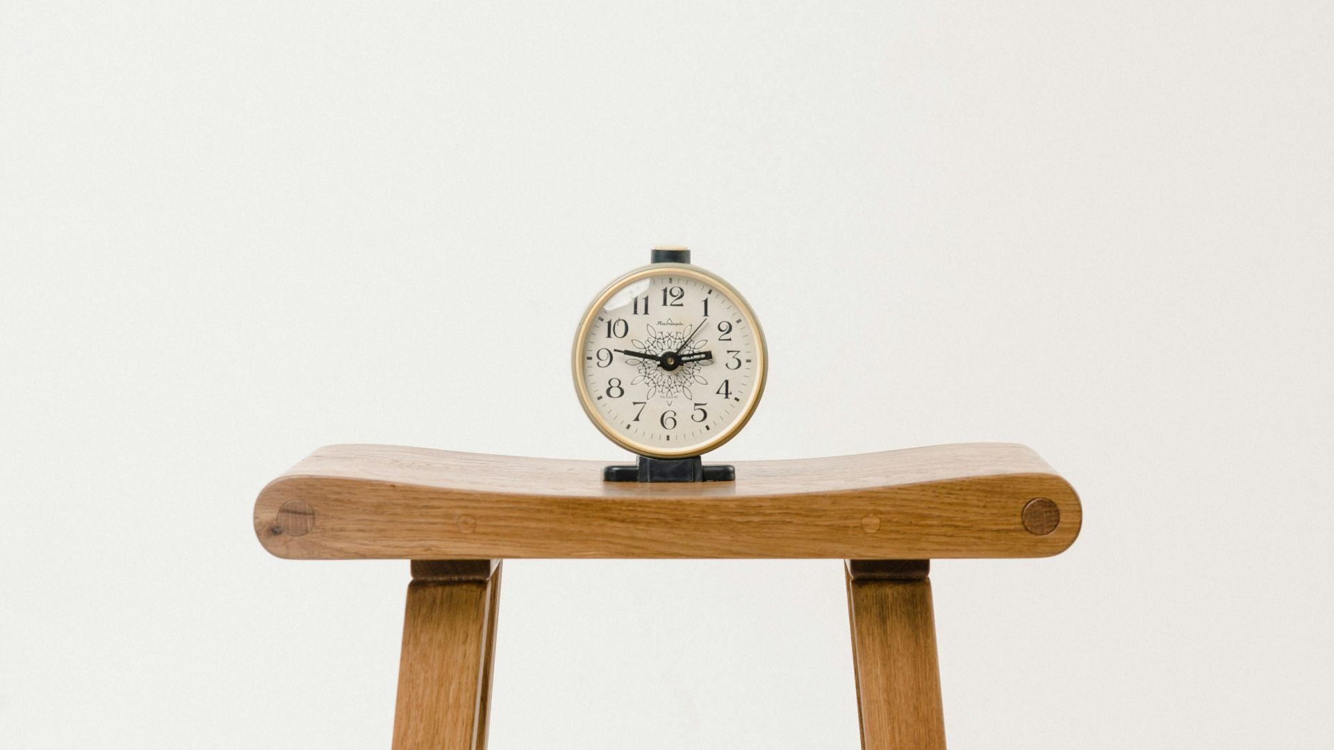 brown wooden table clock at 10 10