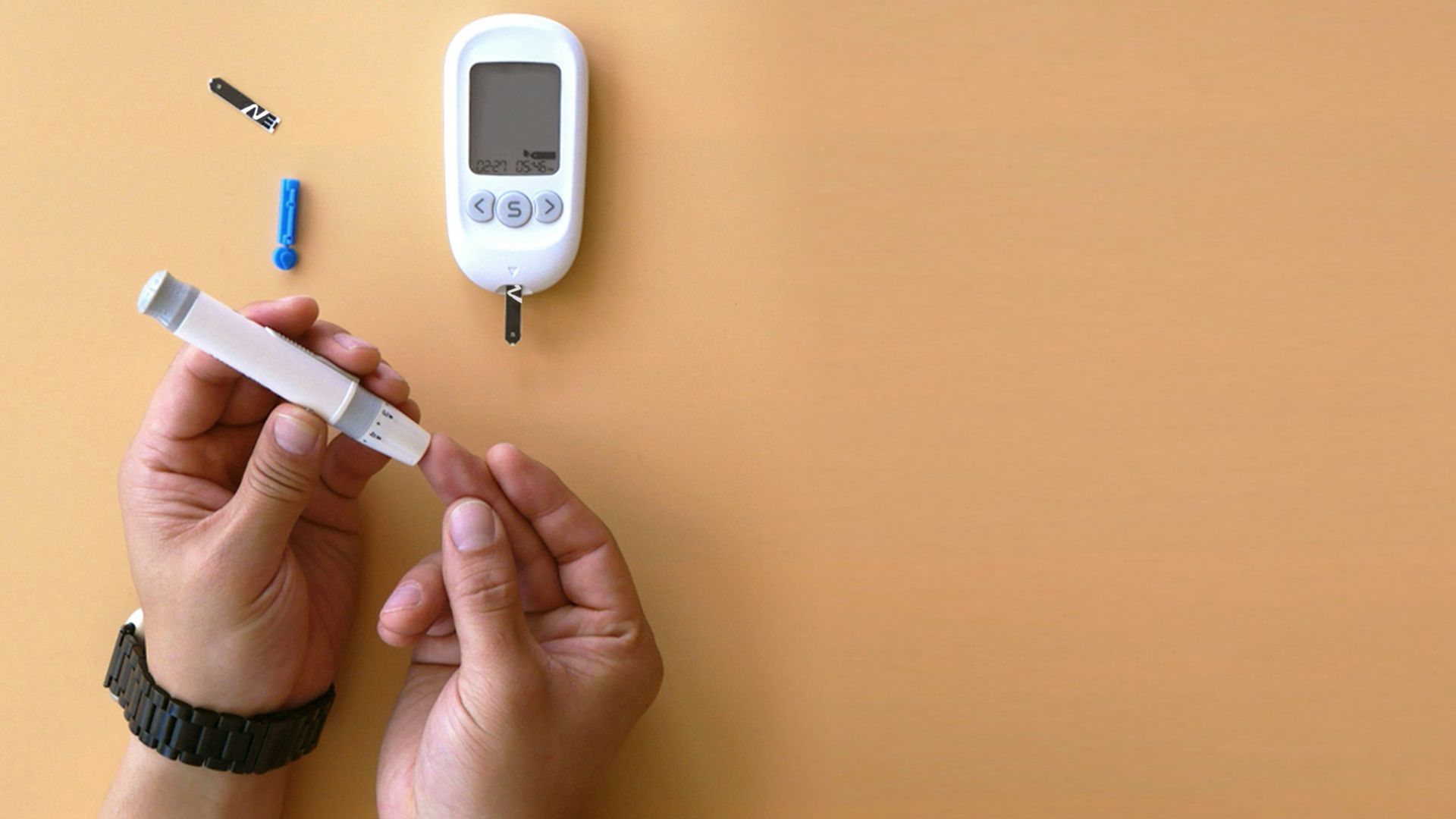 a person holding a thermometer next to an electronic device