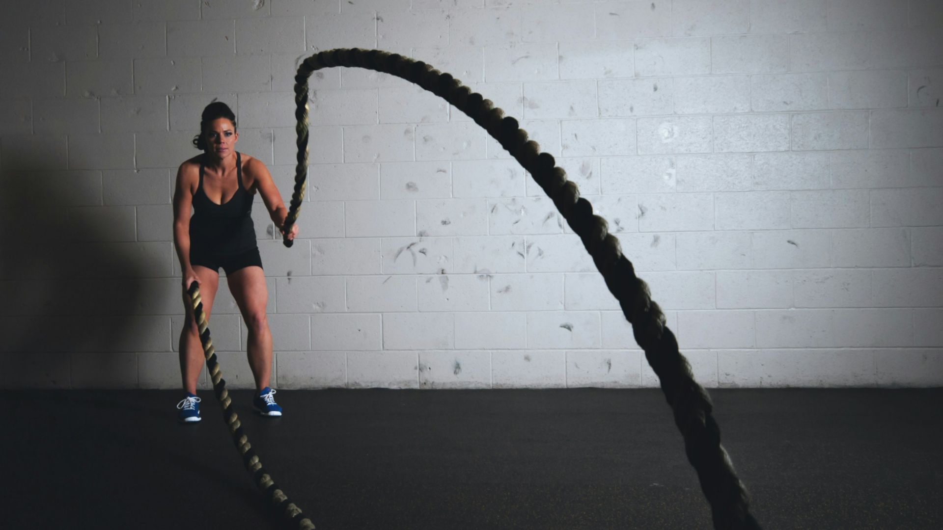 woman holding brown ropes