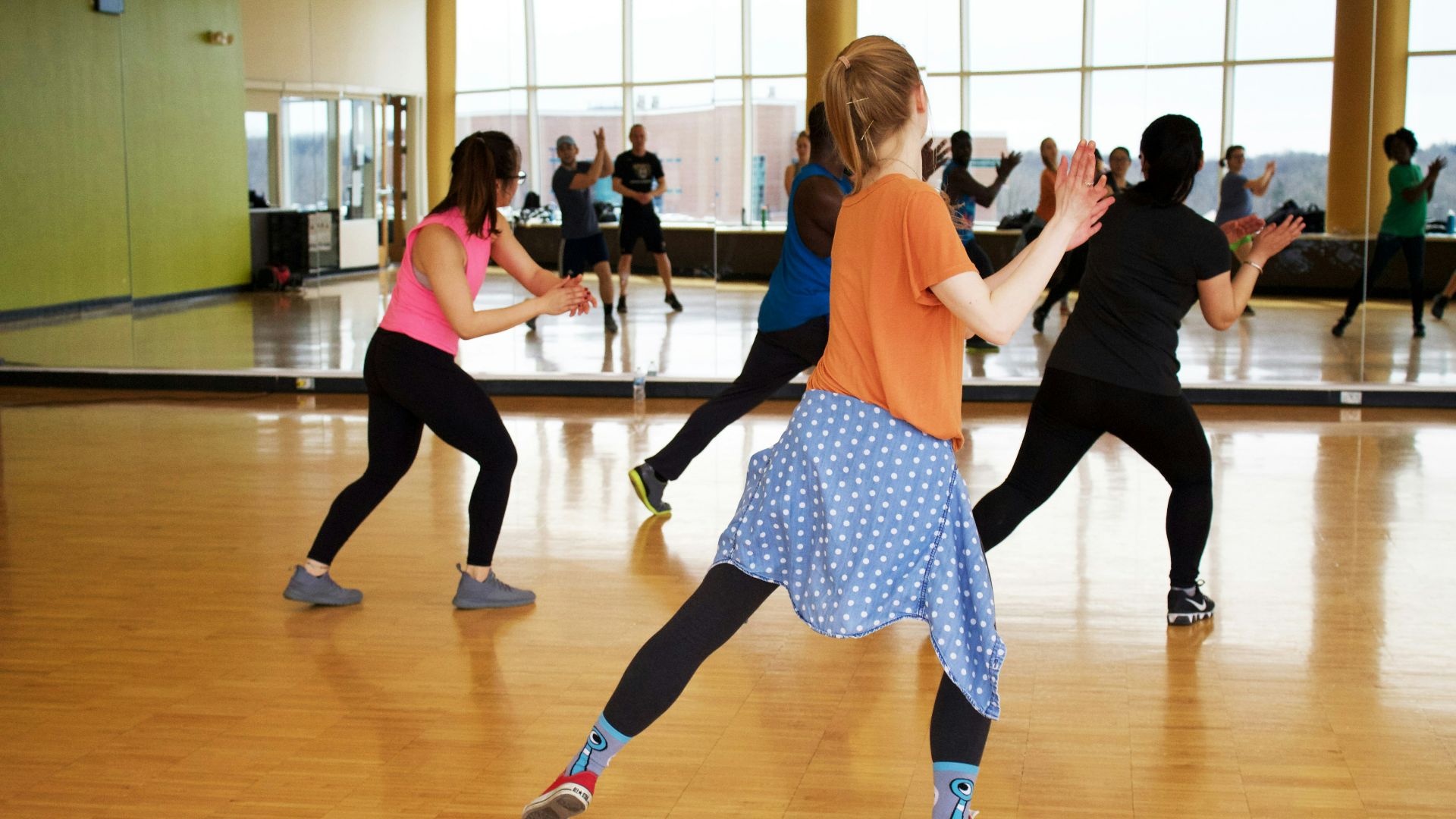 women dancing near mirror