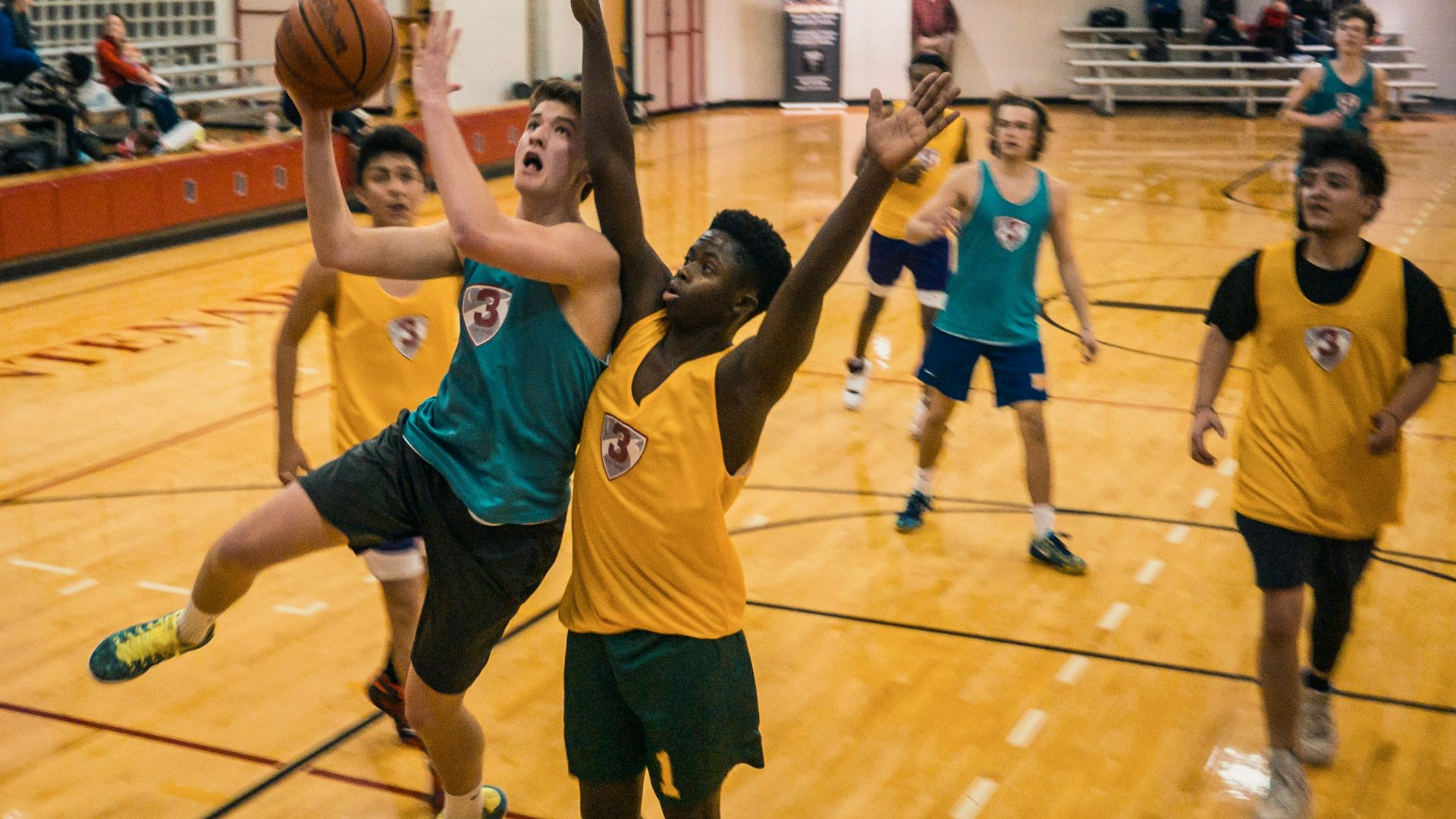group of people playing basketball