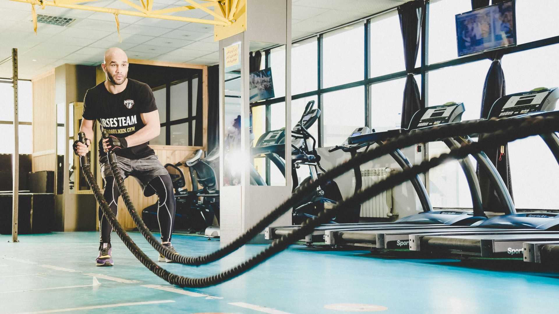 man in black and white crew neck t-shirt sitting on black wheelchair
