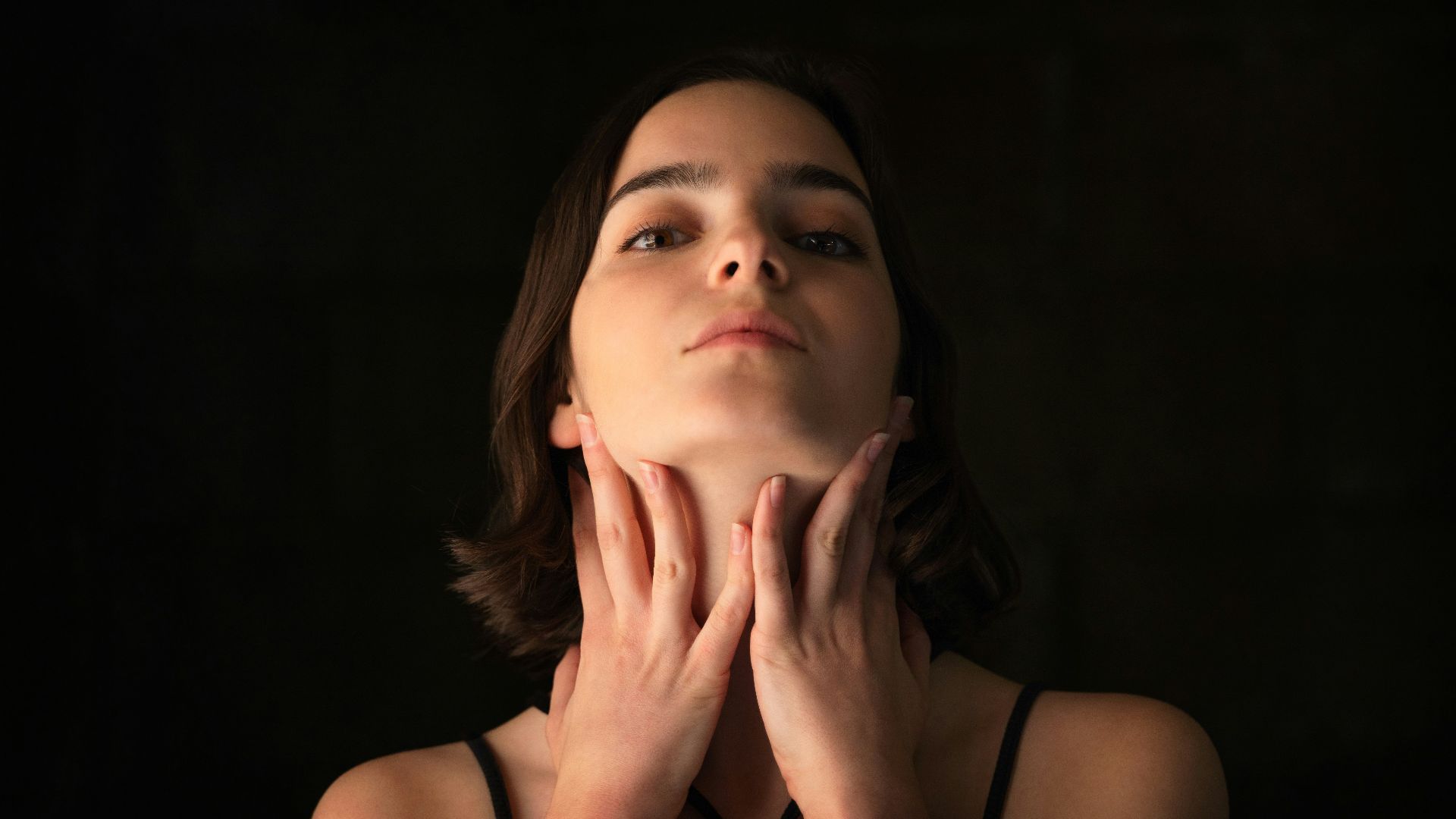 woman in black spaghetti strap top