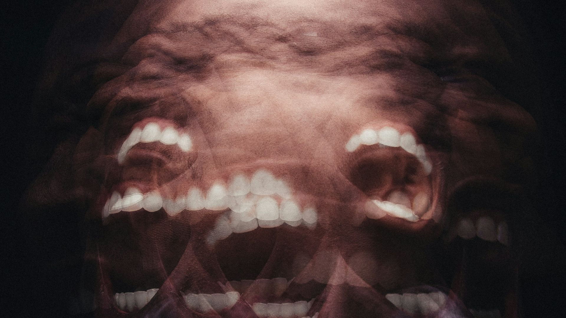 mans face with white scarf