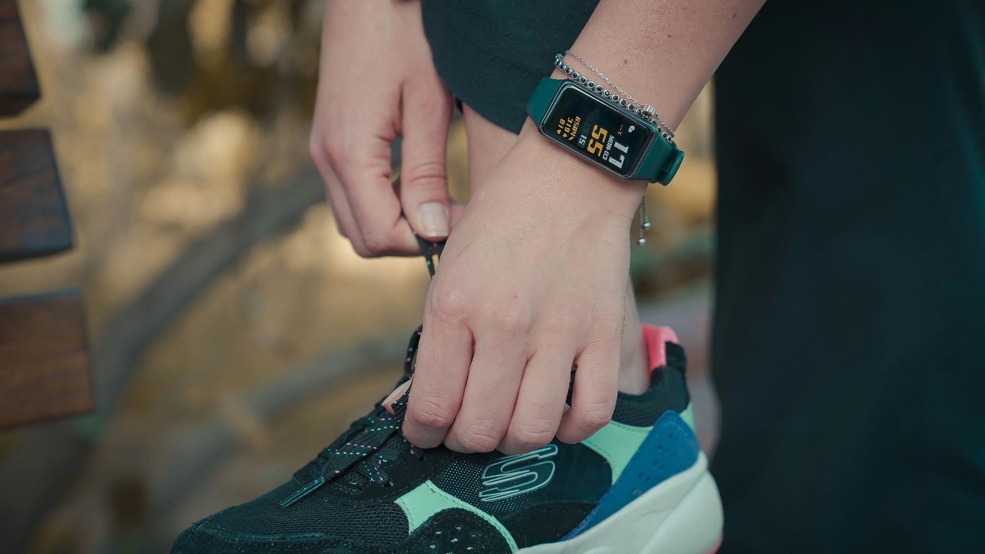 person wearing black and green nike air max