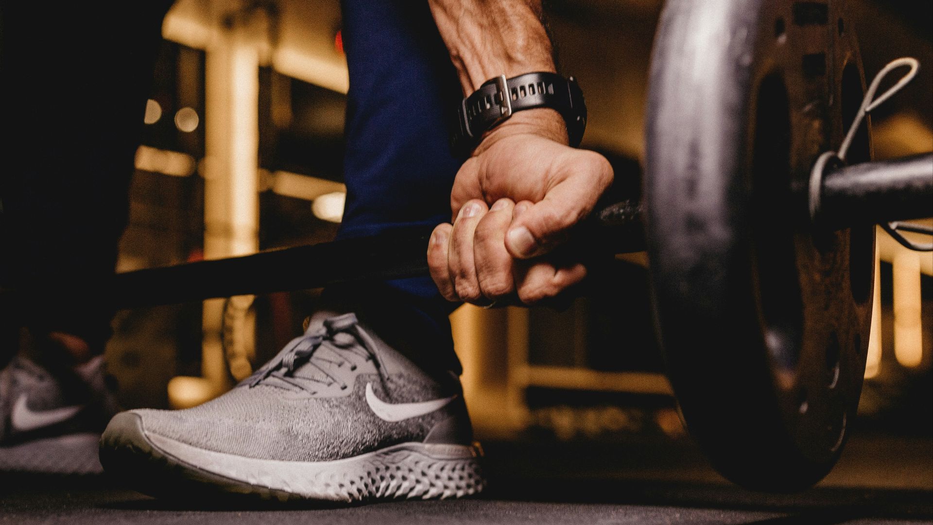 person about to lift barbell