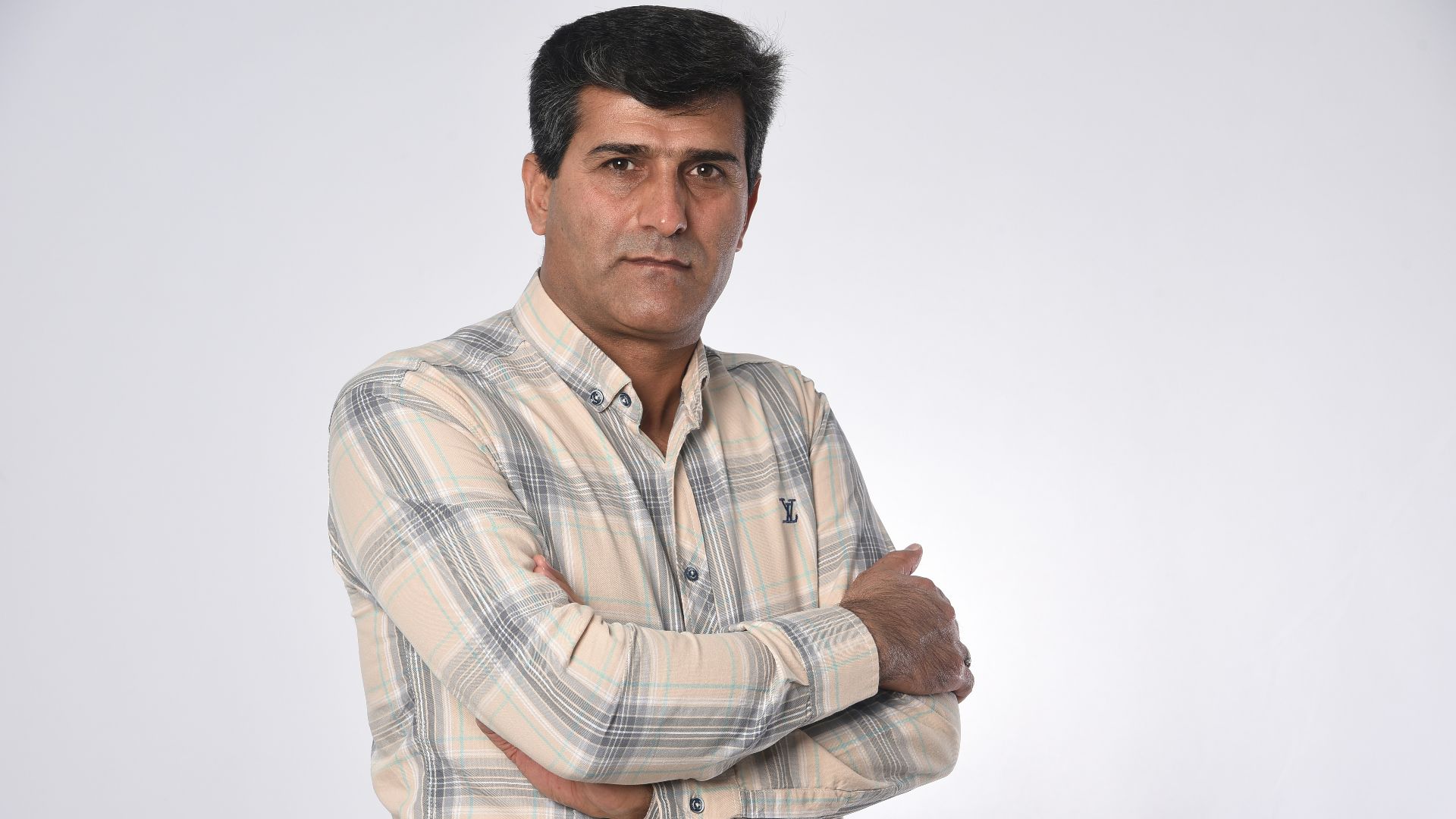 man in white brown and black plaid button up shirt