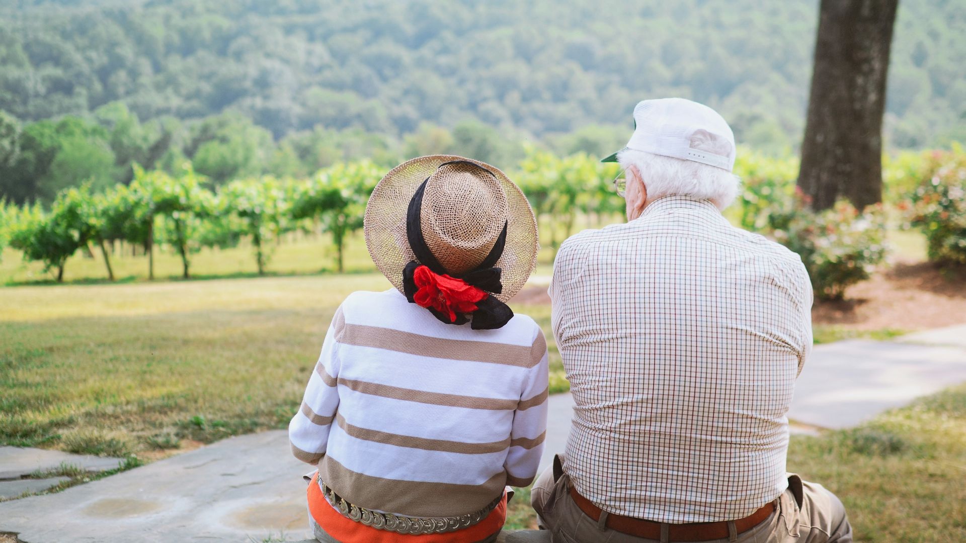 couple sitting on pathway