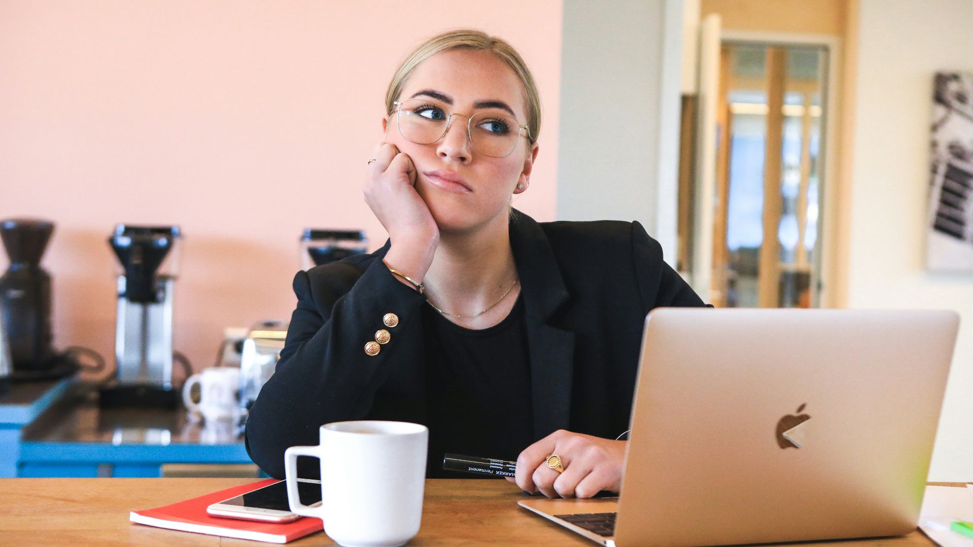 woman in black long sleeve shirt using macbook