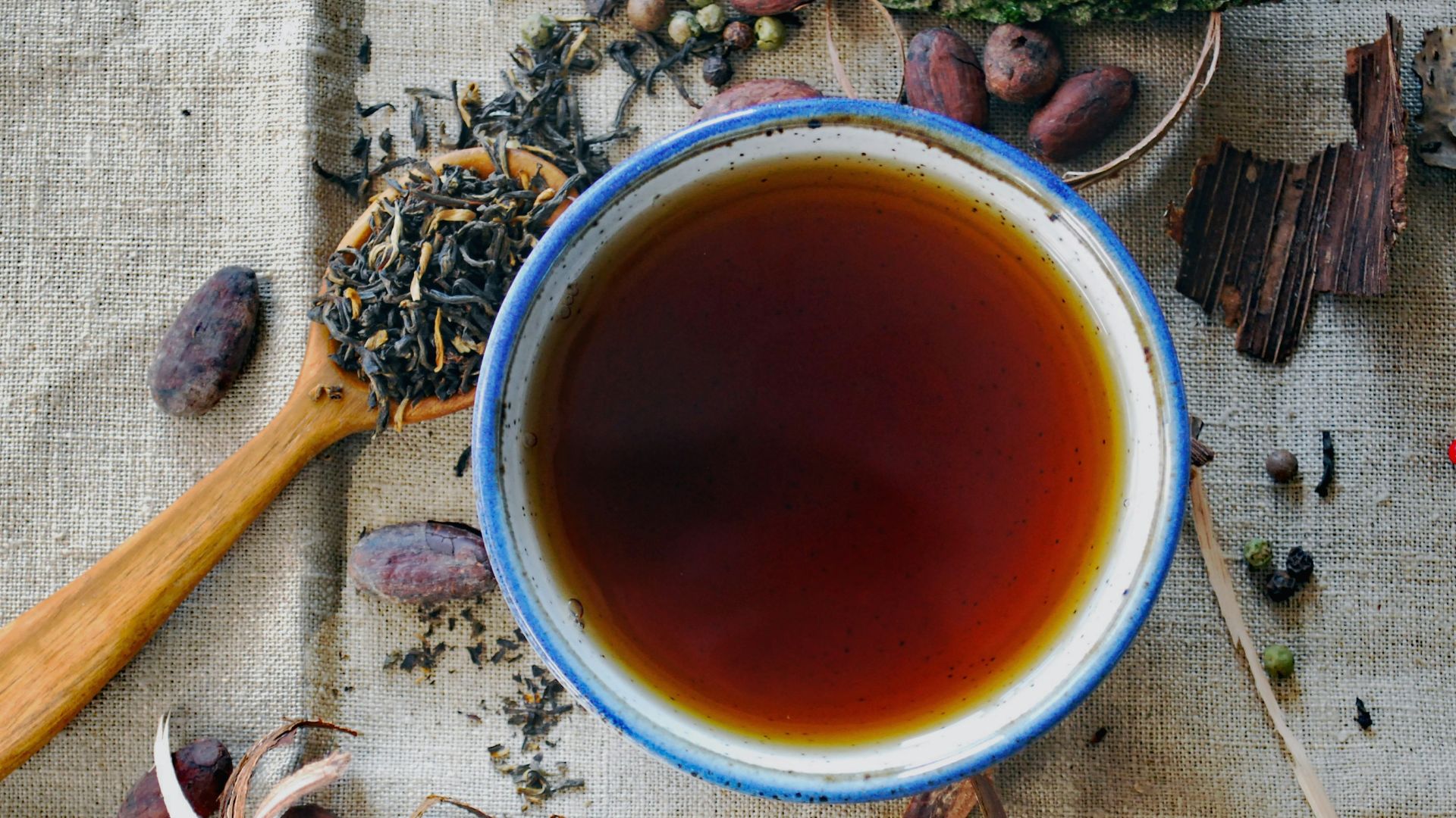 white and brown ceramic mug