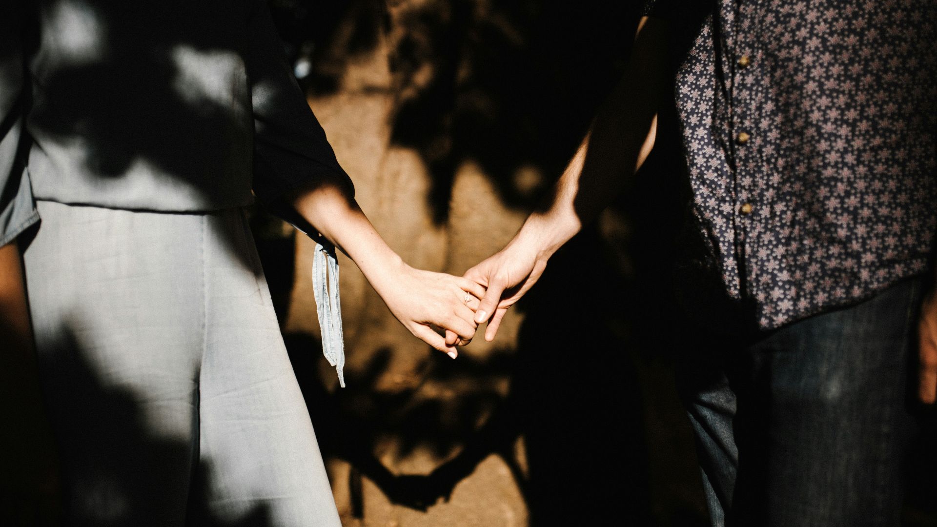 man and woman holding hands