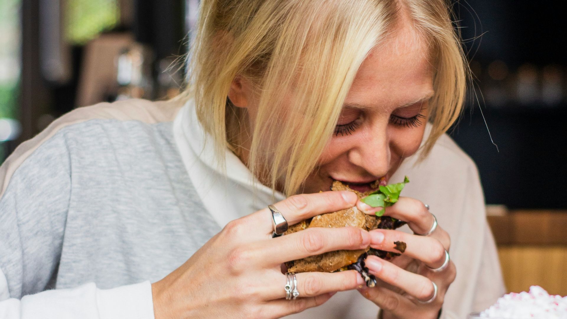 woman eating burger