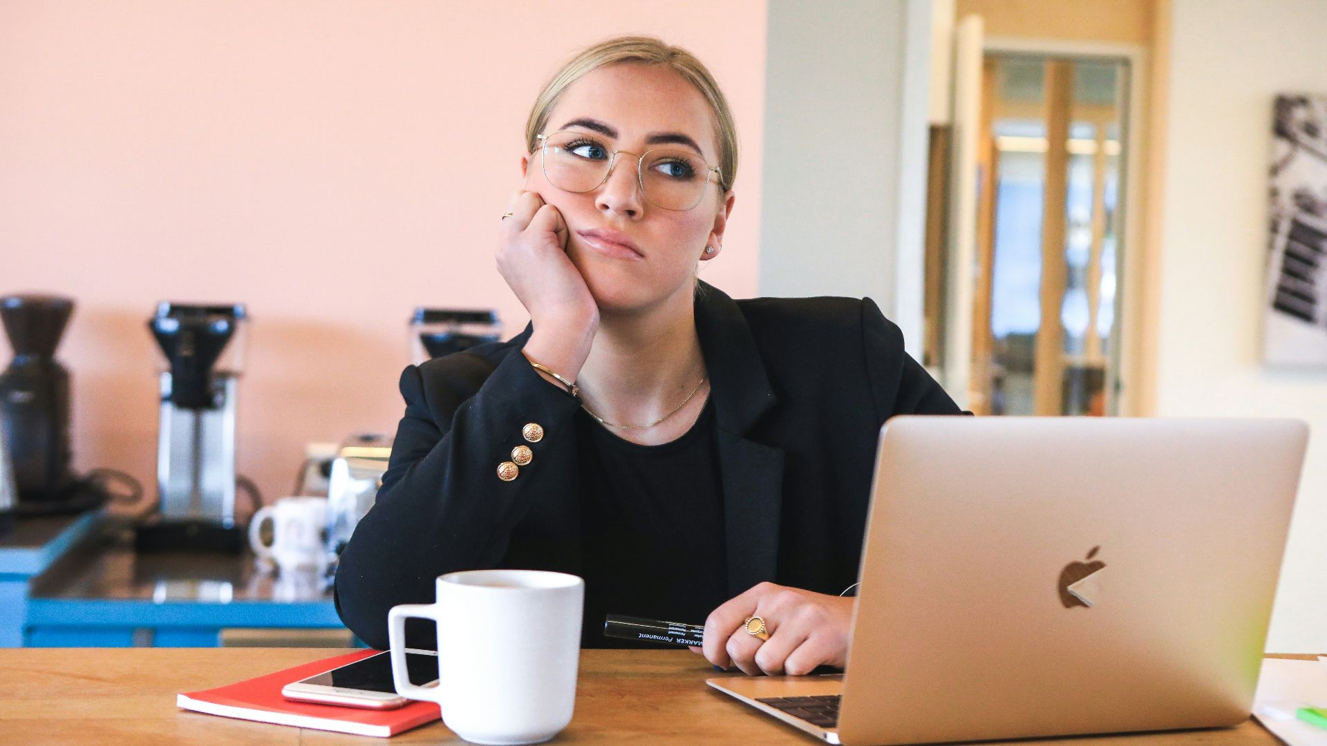 woman in black long sleeve shirt using macbook