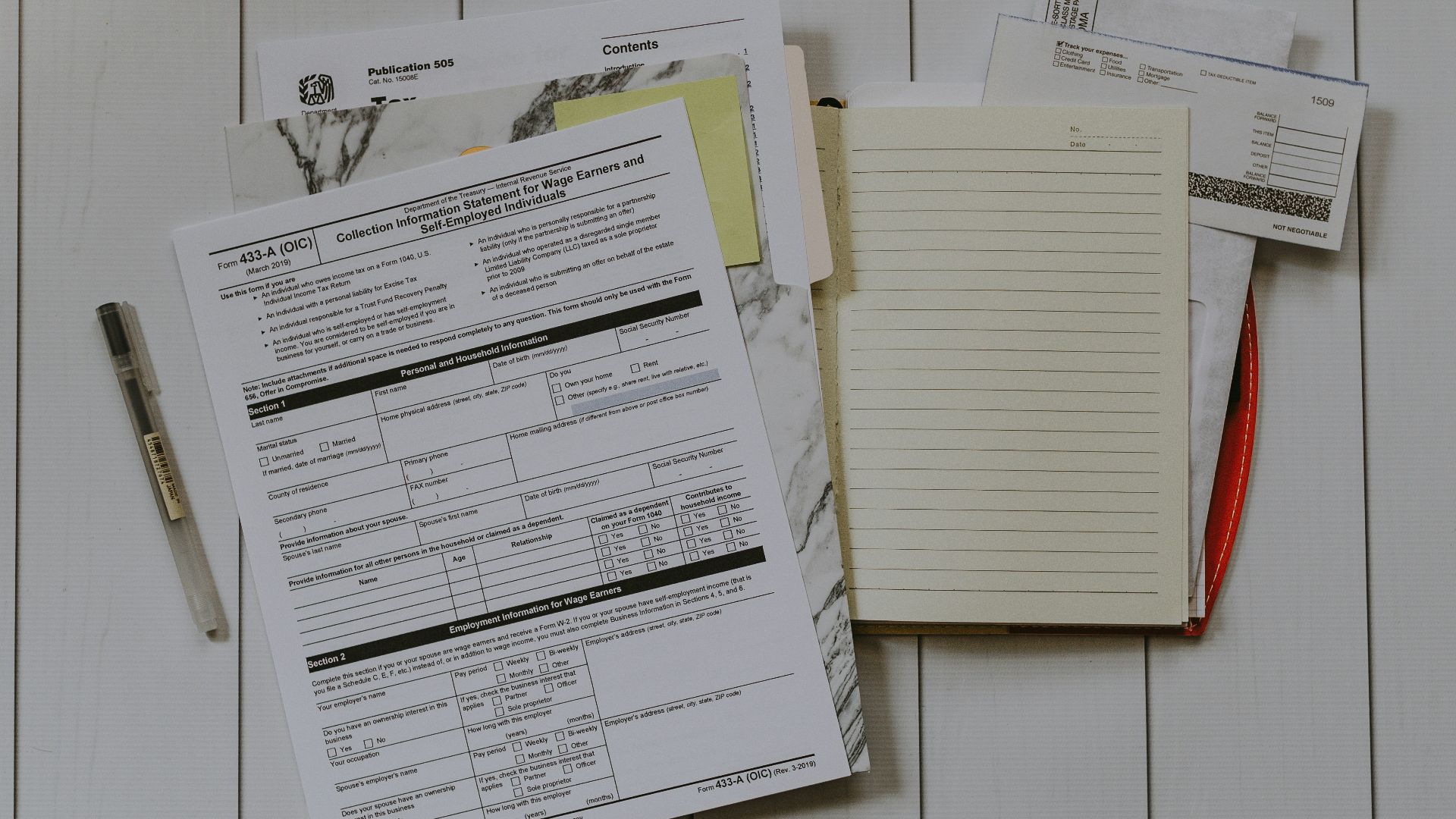 stack of papers flat lay photography