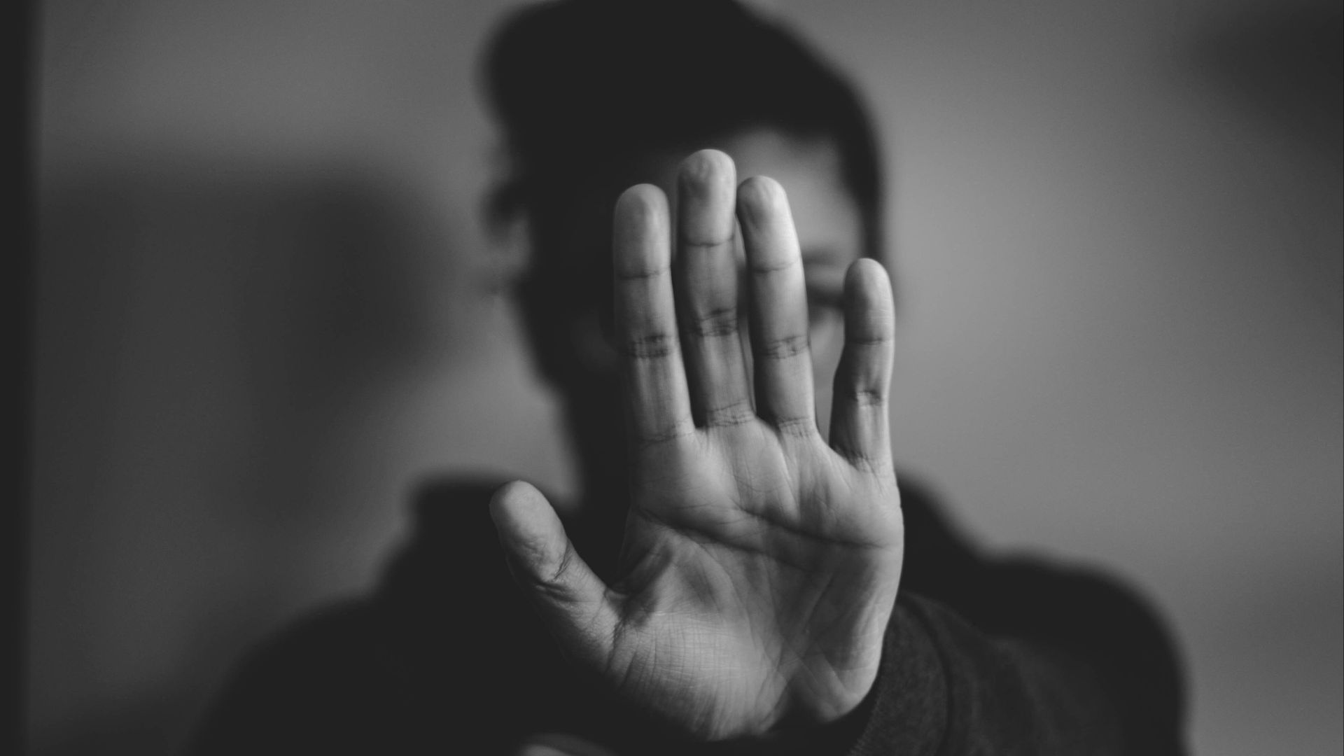 close-up photography of person lifting hands