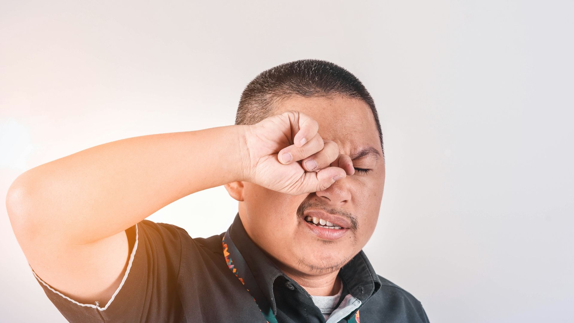 man wearing black collared shirt