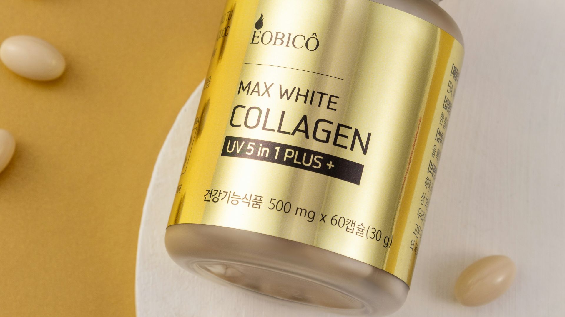 a jar of collagen on a plate with almonds