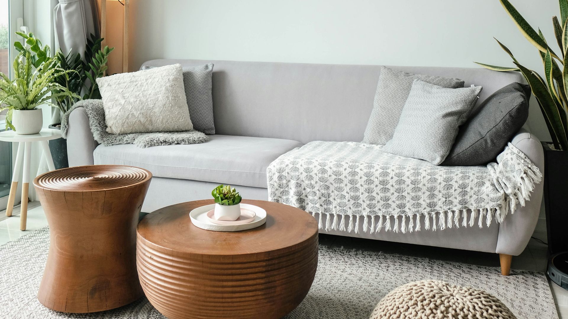a living room filled with furniture and a large window