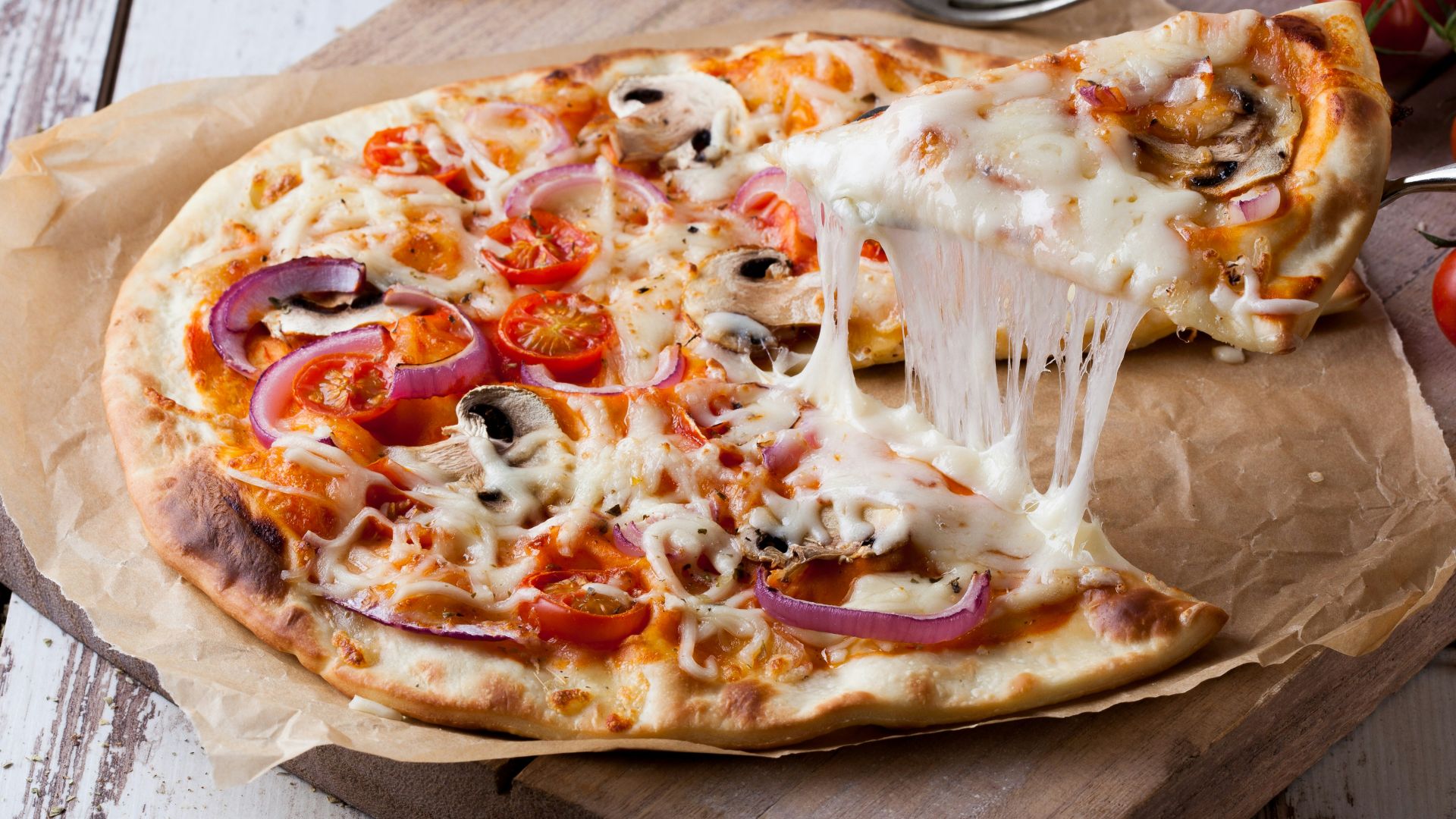 pizza on brown wooden tray