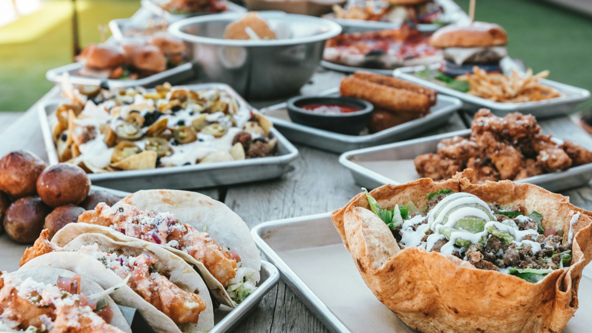 selective focus photography of plates of food on table during daytime