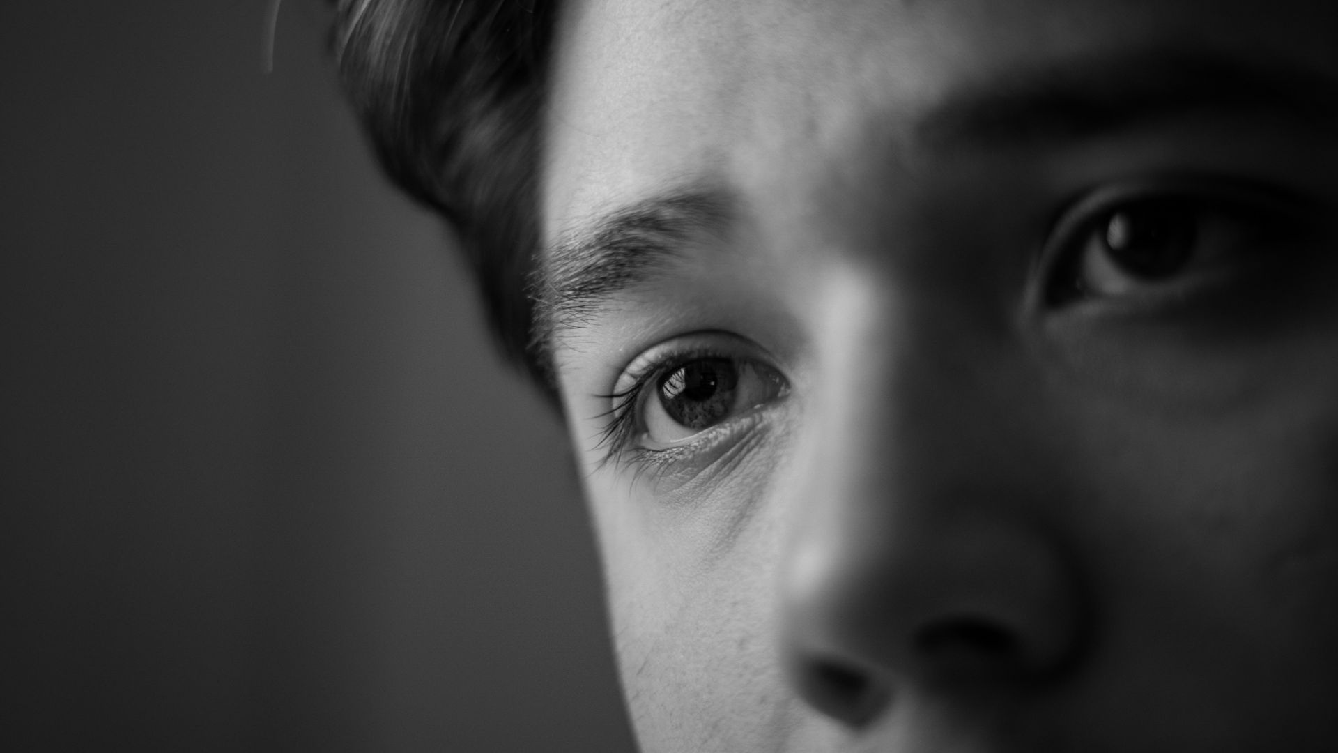 grayscale photo of womans face