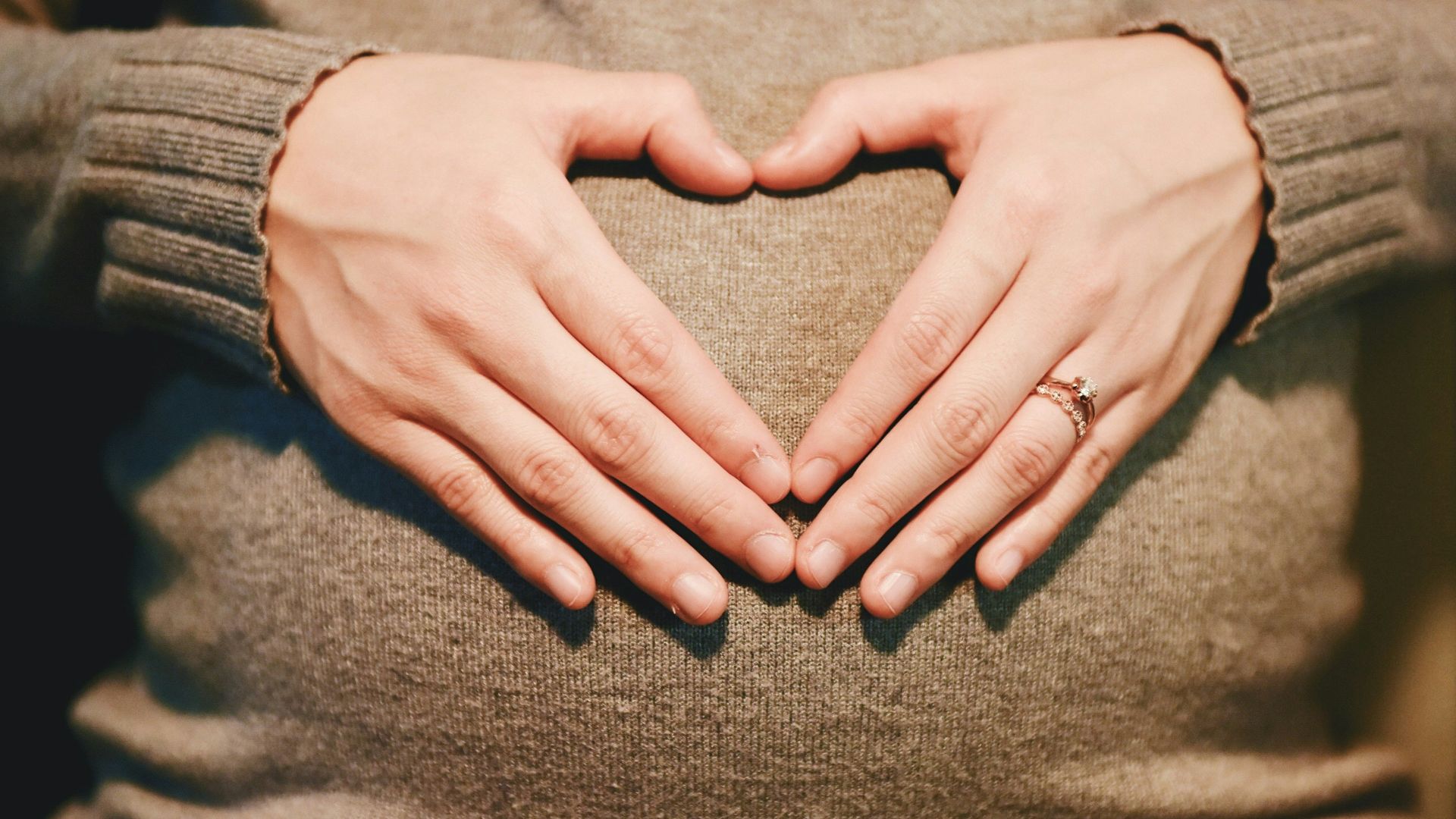 person holding belly photo