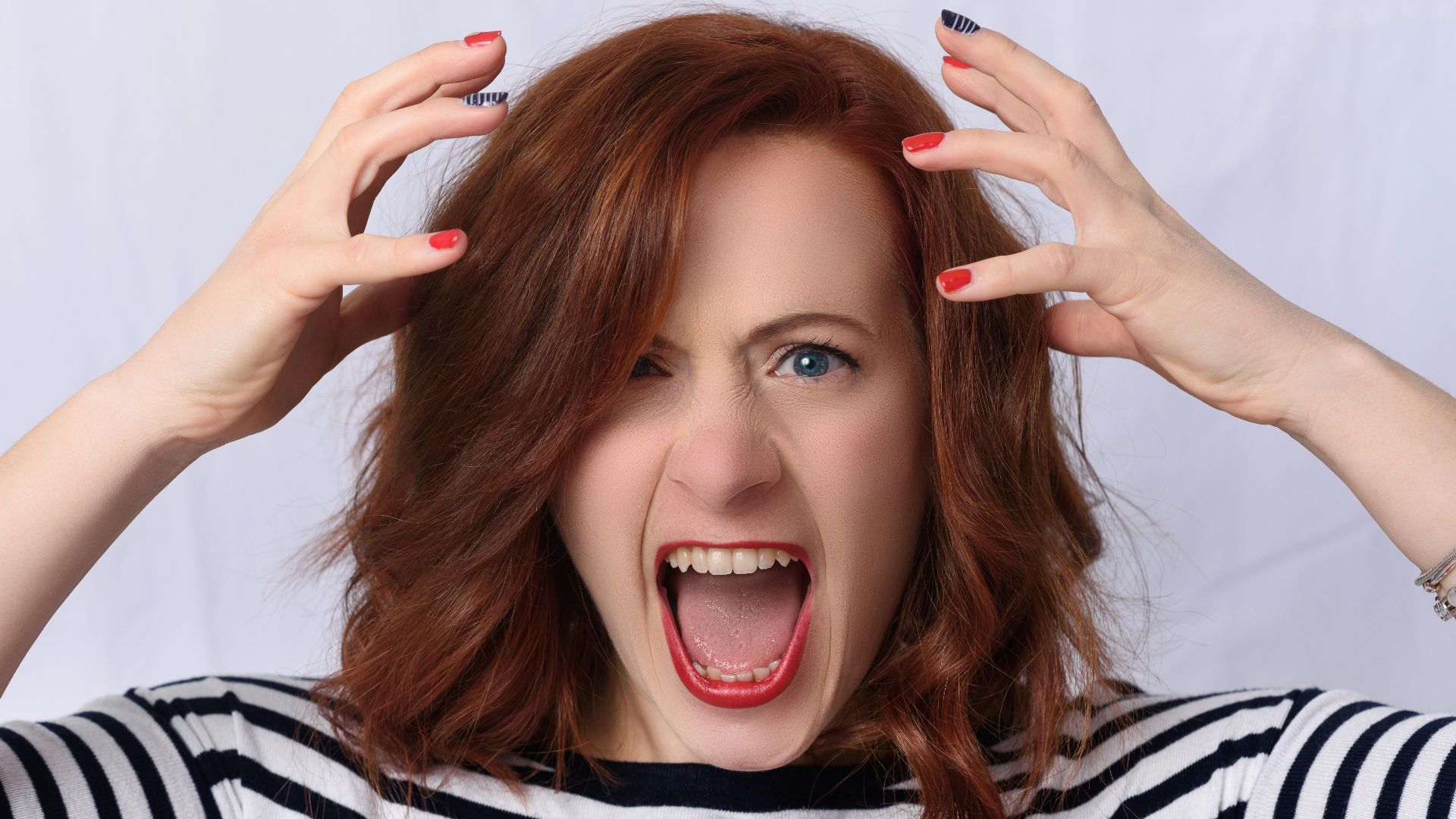 smiling girl in black and white striped shirt