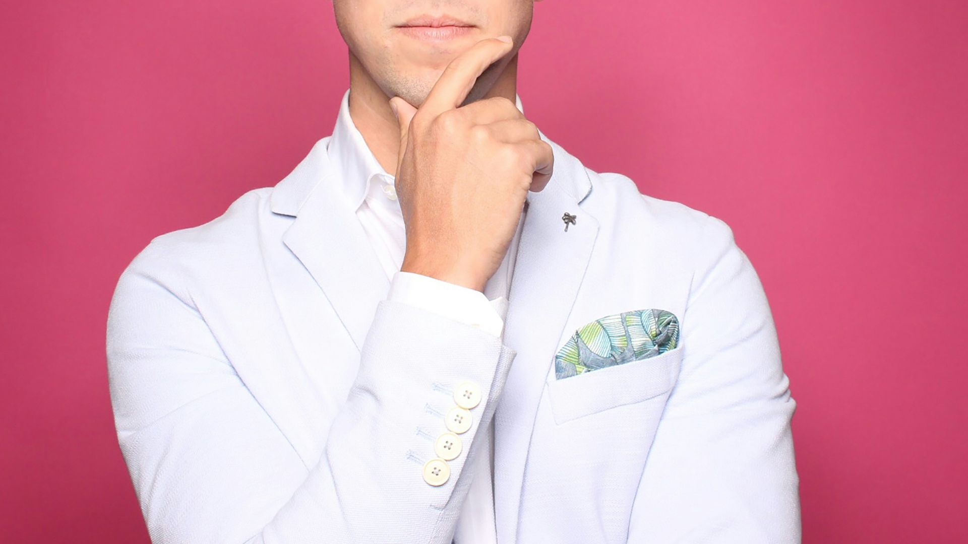 man in white suit jacket