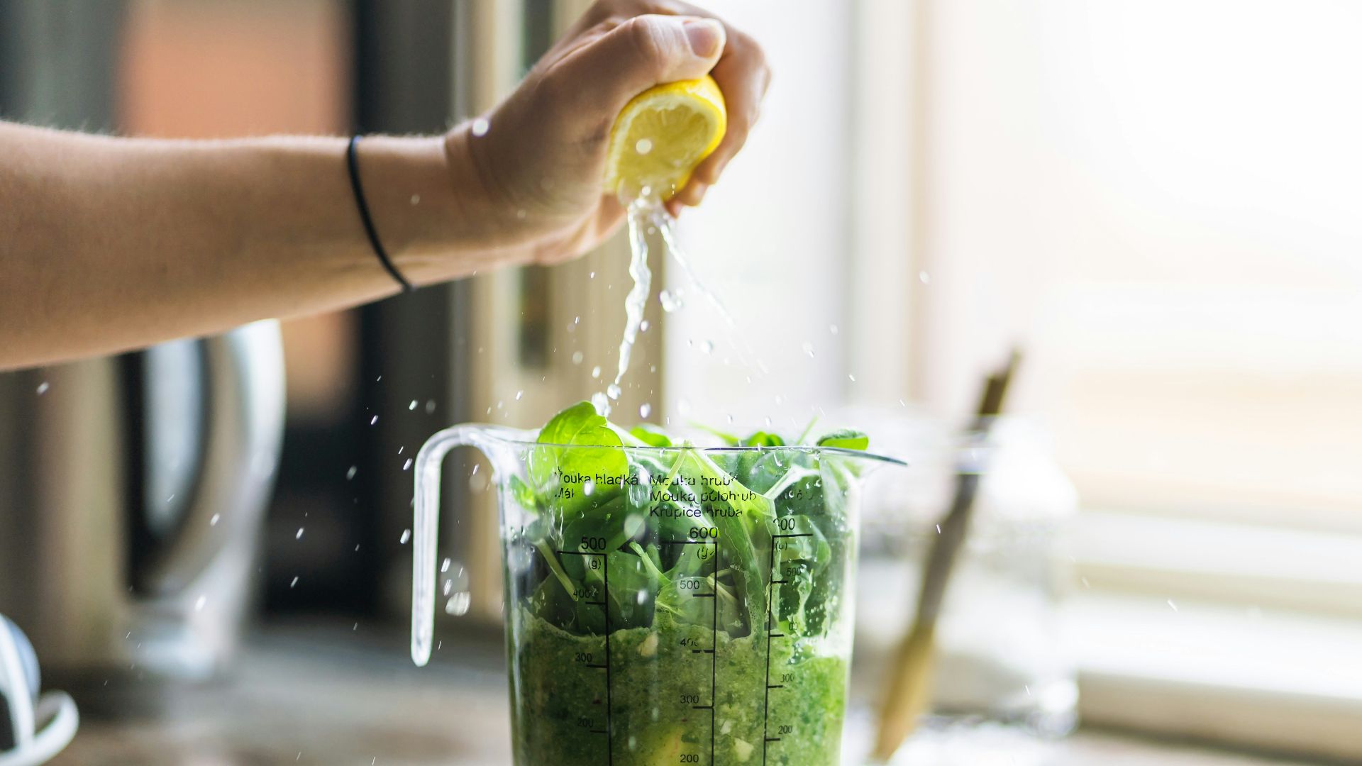 person squeezing lemon