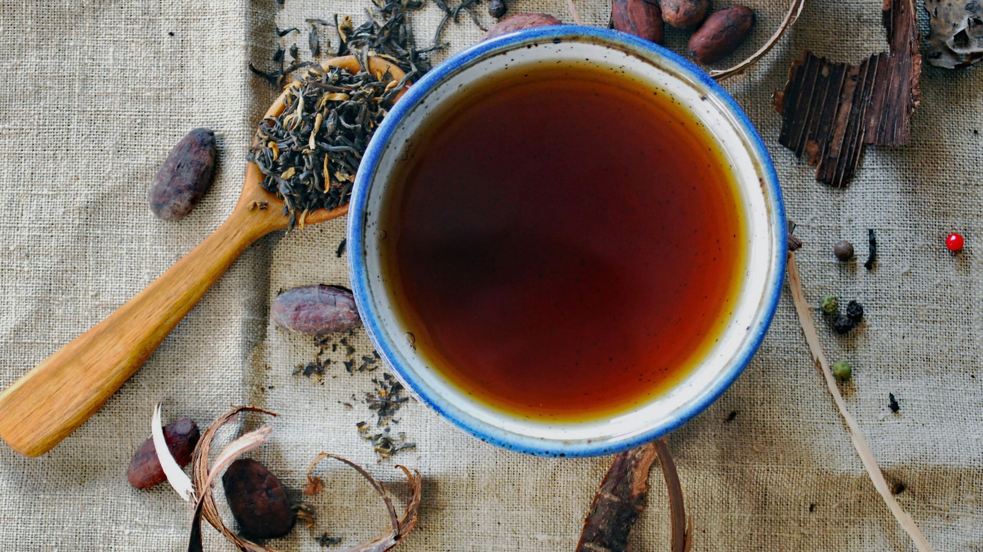 white and brown ceramic mug