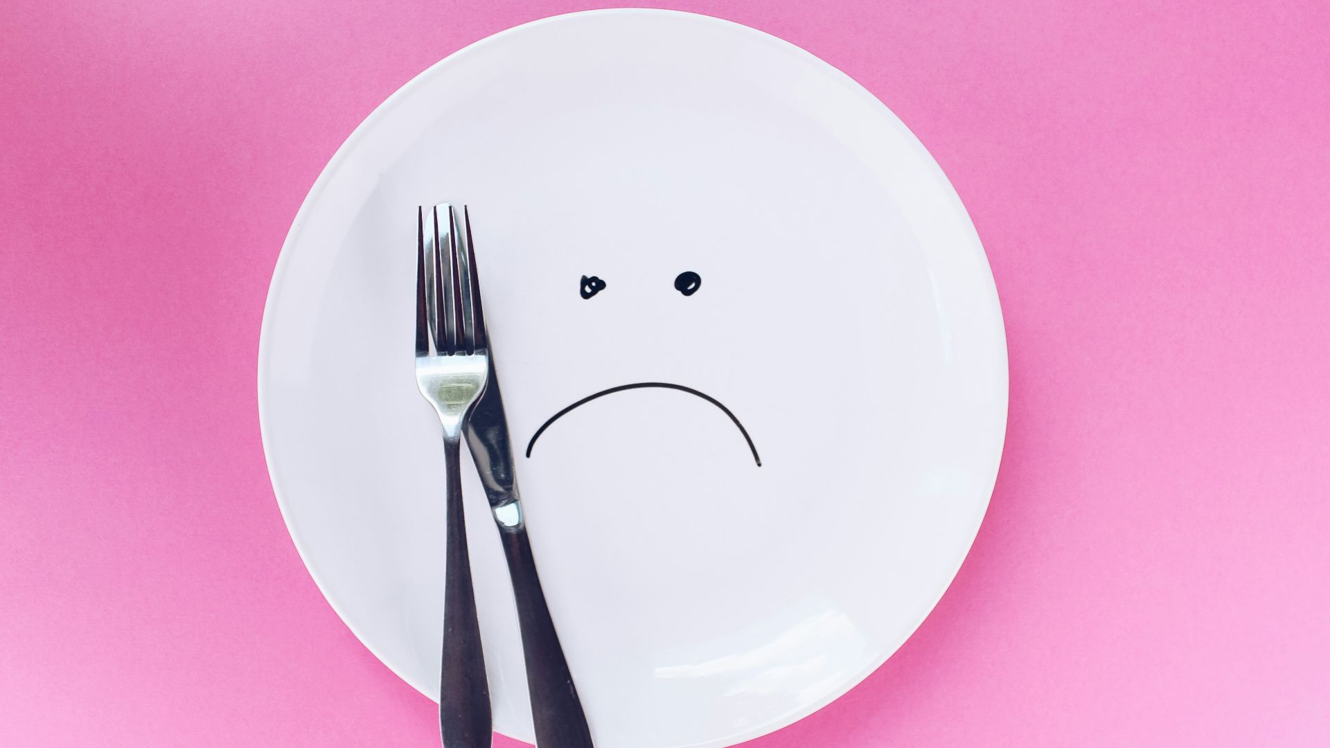 silver fork and knife on plate